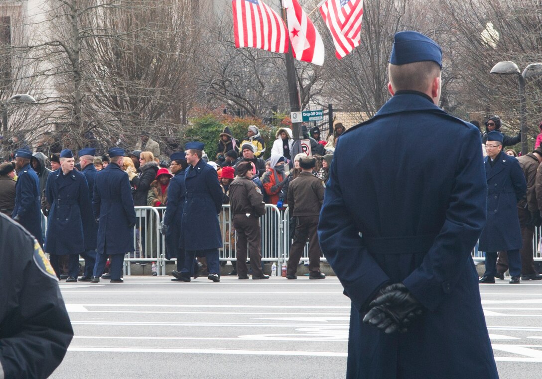 Airmen of the Air Force cordon stand ready to provide honors to the president as commander in chief, the vice president, and the National Colors in Washington Jan. 21, 2013. Airmen participating in the Inaugural events represented one component of the integrated total force - Soldiers, Marines, Sailors, Airmen, and Coast Guardsmen - proudly serving their country at home and around the world. (U.S. Air Force photo by 1st Lt. Ashleigh Peck)