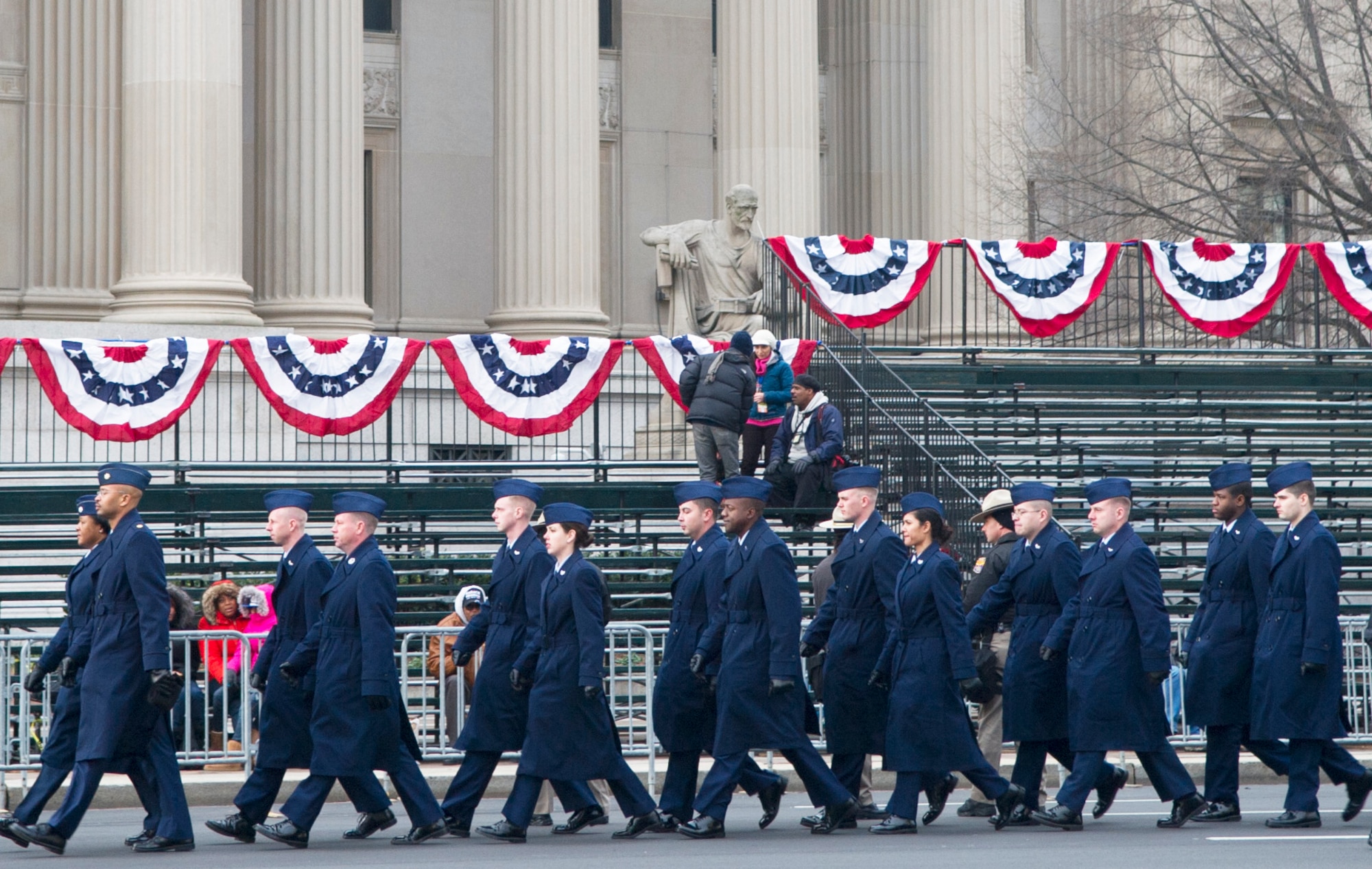 Airmen of the Air Force cordon march down Pennsylvania Avenue in Washington to their designated location prior to the start of the 57th Presidential Inaugural Parade Jan. 21, 2013.  Airmen participating in the Inaugural events represented one component of the integrated total force - Soldiers, Marines, Sailors, Airmen, and Coast Guardsmen - proudly serving their country at home and around the world. (U.S. Air Force photo by 1st Lt. Ashleigh Peck)