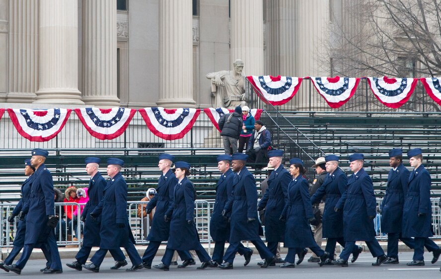 Airmen of the Air Force cordon march down Pennsylvania Avenue in Washington to their designated location prior to the start of the 57th Presidential Inaugural Parade Jan. 21, 2013.  Airmen participating in the Inaugural events represented one component of the integrated total force - Soldiers, Marines, Sailors, Airmen, and Coast Guardsmen - proudly serving their country at home and around the world. (U.S. Air Force photo by 1st Lt. Ashleigh Peck)