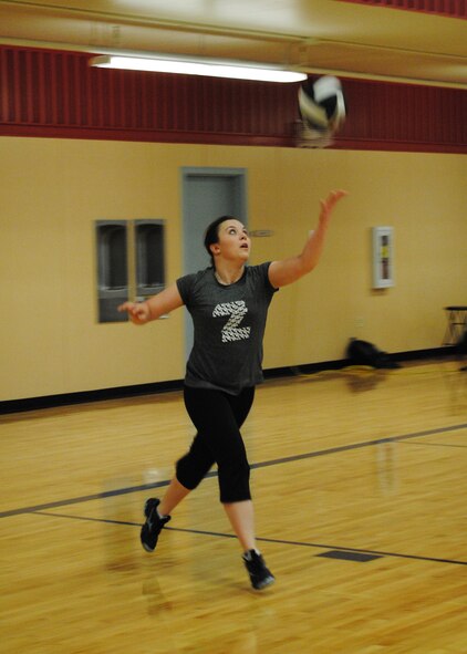 Kyah Piva, a member of the “Bandana Brigade” team, serves a ball to her opponents.  All teams who participated in the tournament were able to give their teams a unique name.  (U.S. Air Force photo/Senior Airman Cortney Paxton)