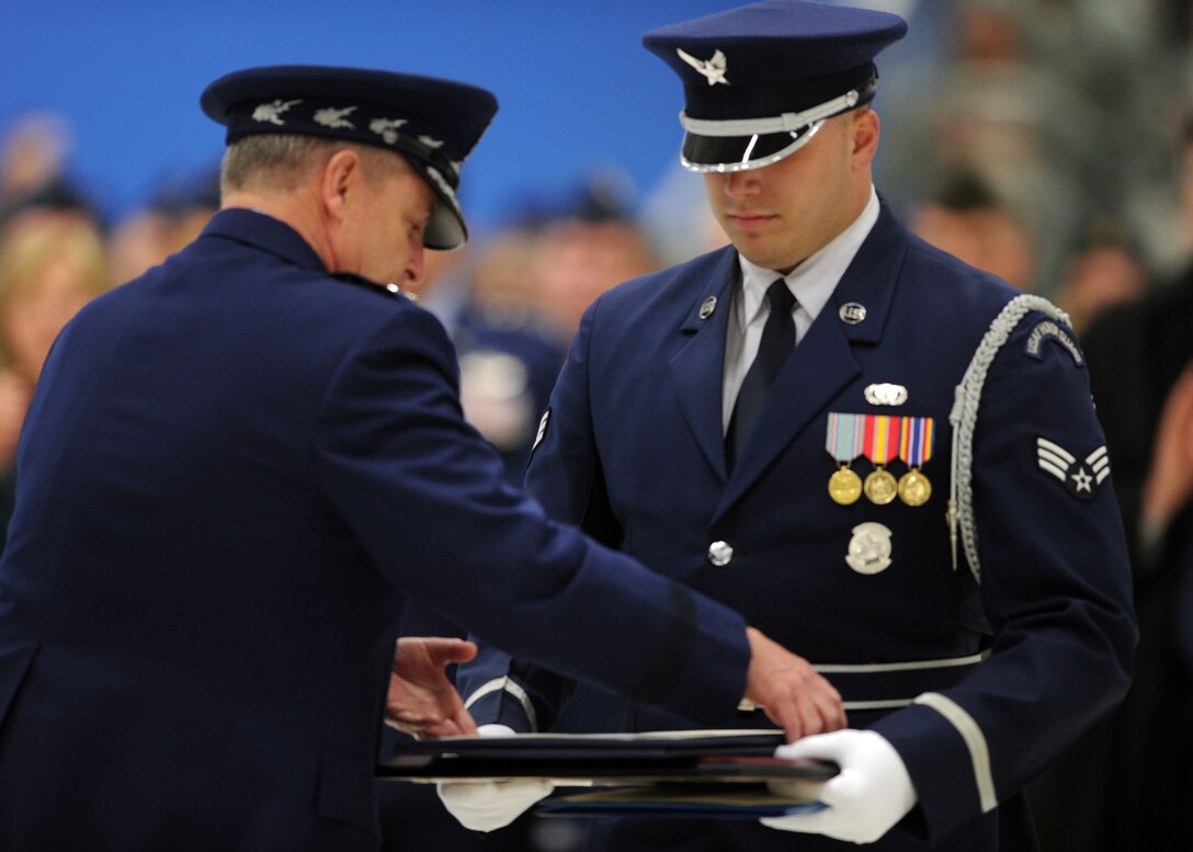 Senior Airman Jeremy Dotson, a U.S. Air Force Honor Guard ceremonial
guardsman, hands a certificate to Air Force Chief of Staff Gen. Mark A.
Welsh III to present to the retiring Chief Master Sgt. of the Air Force
James Roy during a chief master sergeant of the Air Force transition
ceremony at Joint Base Andrews, Md., on Jan. 24, 2013. The U.S. Air Force
Band and Honor Guard honored the retiring Chief Master Sgt. of the Air Force
James Roy and welcomed new Chief Master Sgt. of the Air Force James Cody
during the ceremony. (U.S. Air Force photo/ Senior Airman Bahja Joi Jones)