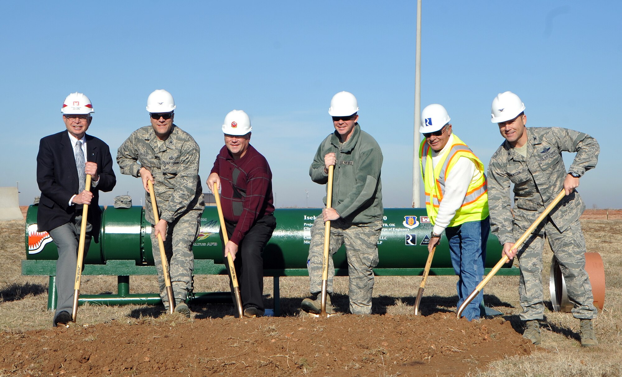 ALTUS AIR FORCE BASE, Okla. – Members of the U.S. Army Corps of Engineers, Reliable Contracting Group, and Altus AFB pose for a picture at the Jet Propellant 8 Fuel Transfer Line groundbreaking, Jan. 23. The groundbreaking was held to kick-off the reestablishment of a steel pipeline, which will connect the bulk fuel storage area to the tanker ramp providing a reliable and efficient way to refuel KC-135 Stratotankers. The fuel line is projected to cost more than $9 million and will save the base money over time through saved man hours and truck deliveries. (U.S. Air Force photo by Airman 1st Class Levin Boland / Released)