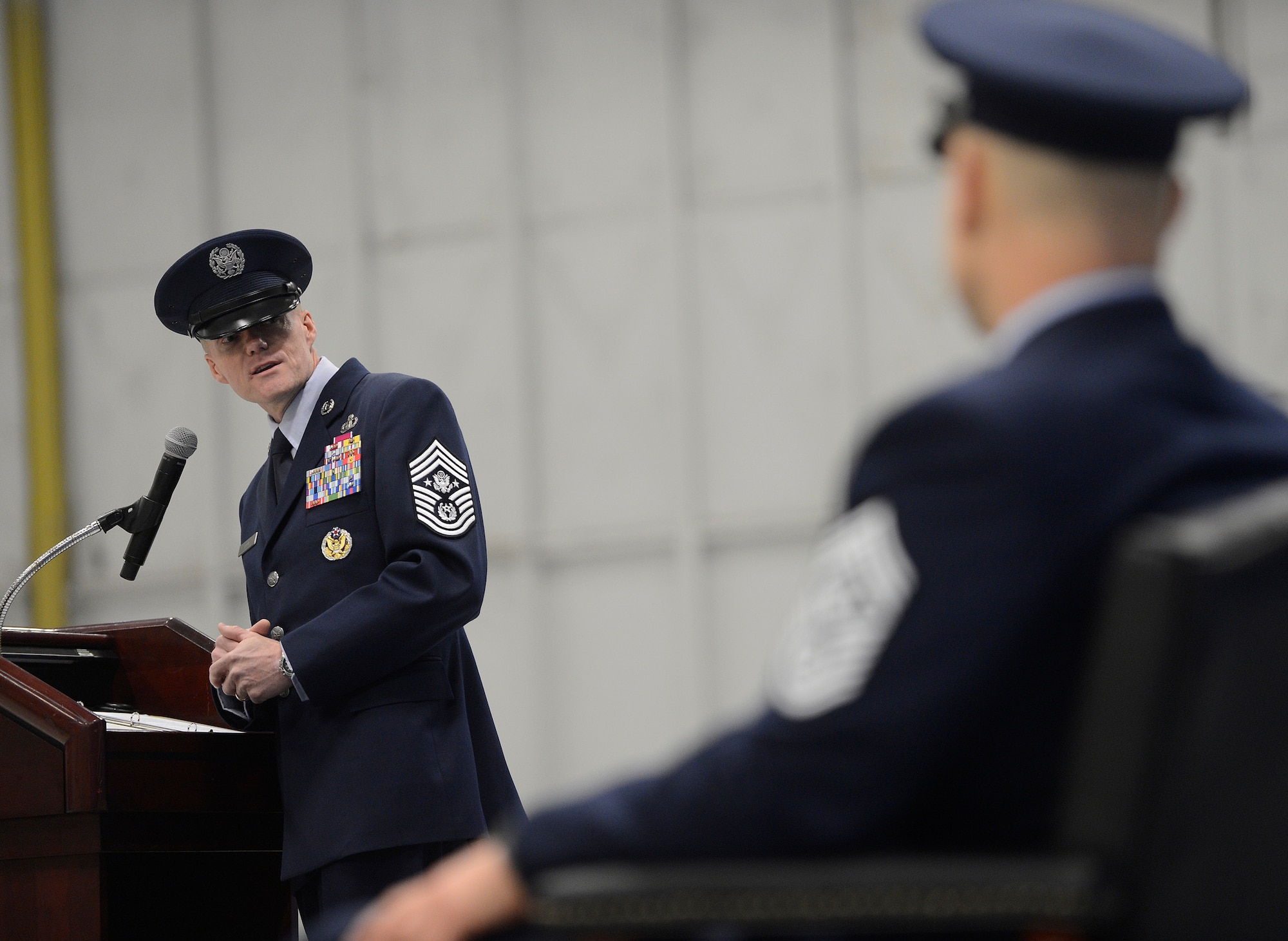 The newly appointed 17th Chief Master Sgt. of the Air Force James Cody thanks freshly retired Chief Master Sgt. of the Air Force James Roy for his years of friendship and guidance during a transition and retirement ceremony, Jan. 24, 2013, on Joint Base Andrews, Md. Roy, the 16th Chief Master Sgt. of the Air Force, retired after more than 30 years of service. Cody then said he was looking forward to getting out to the bases, meeting Airmen and working their challenges. (U.S. Air Force photo/Jim Varhegyi)