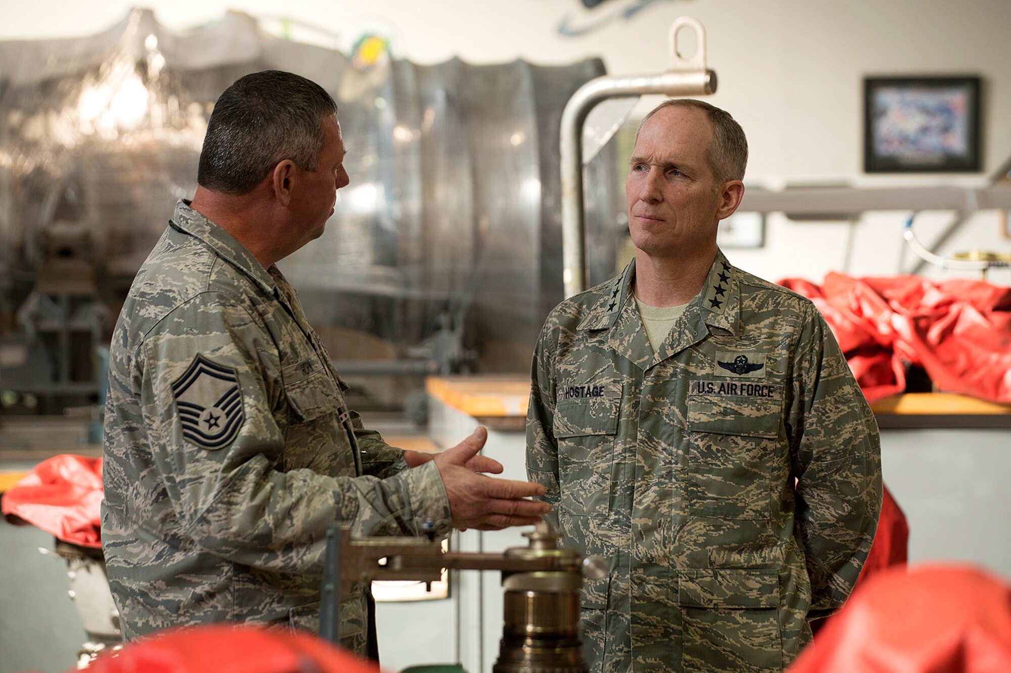 U.S. Air Force Senior Master Sgt. Alan Horn, 917th Maintenance Squadron A-10 Engine Regional Repair Center supervisor, talks to Gen. Michael Hostage during his tour of the 917th Fighter Group, Jan. 23, 2013, Barksdale Air Force Base, La. Hostage, Air Combat Command commander, visited Barksdale during his tour of ACC units. (U.S. Air Force photo by Master Sgt. Greg Steele/Released)