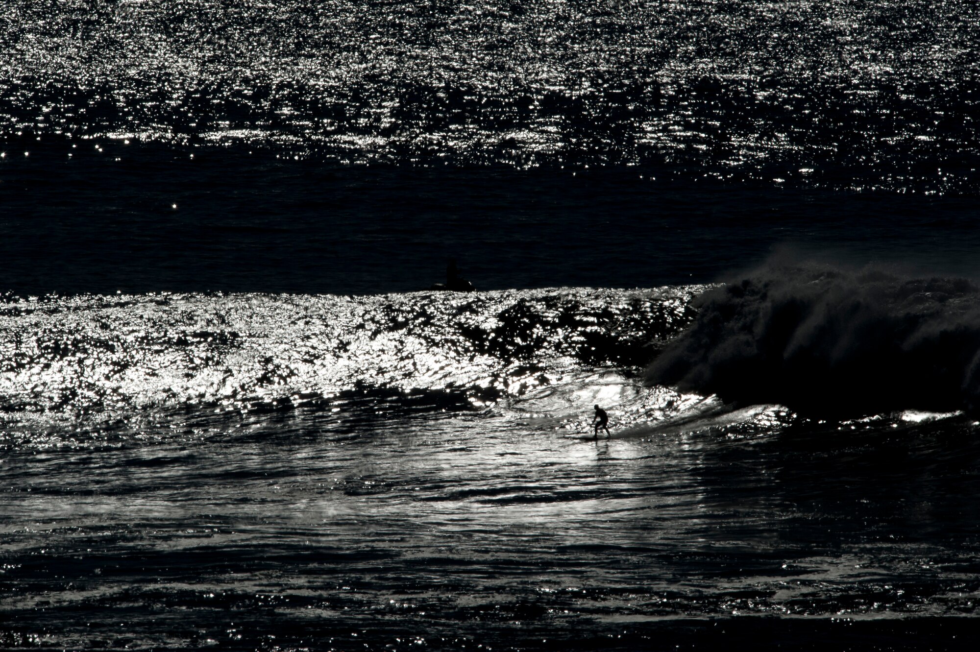 HALF MOON BAY, Calif. – Peter Mel, Santa Cruz professional surfer, hugs his surfboard during the 2013 Mavericks Invitational just north of Half Moon Bay here Sunday, Jan. 20, 2013. Mavericks are waves that can crest up to 50 feet with tremendously strong currents, dangerous rocks and shallow reefs coupled with frigid water temperatures, which attract attention from surfers world-wide.  Peter Mel would eventually go on to win the Invitational, at the age of 43, after tackling the biggest wave ever ridden on the West Coast in 1999. (U.S. Air Force photo/Senior Airman Lael Huss)