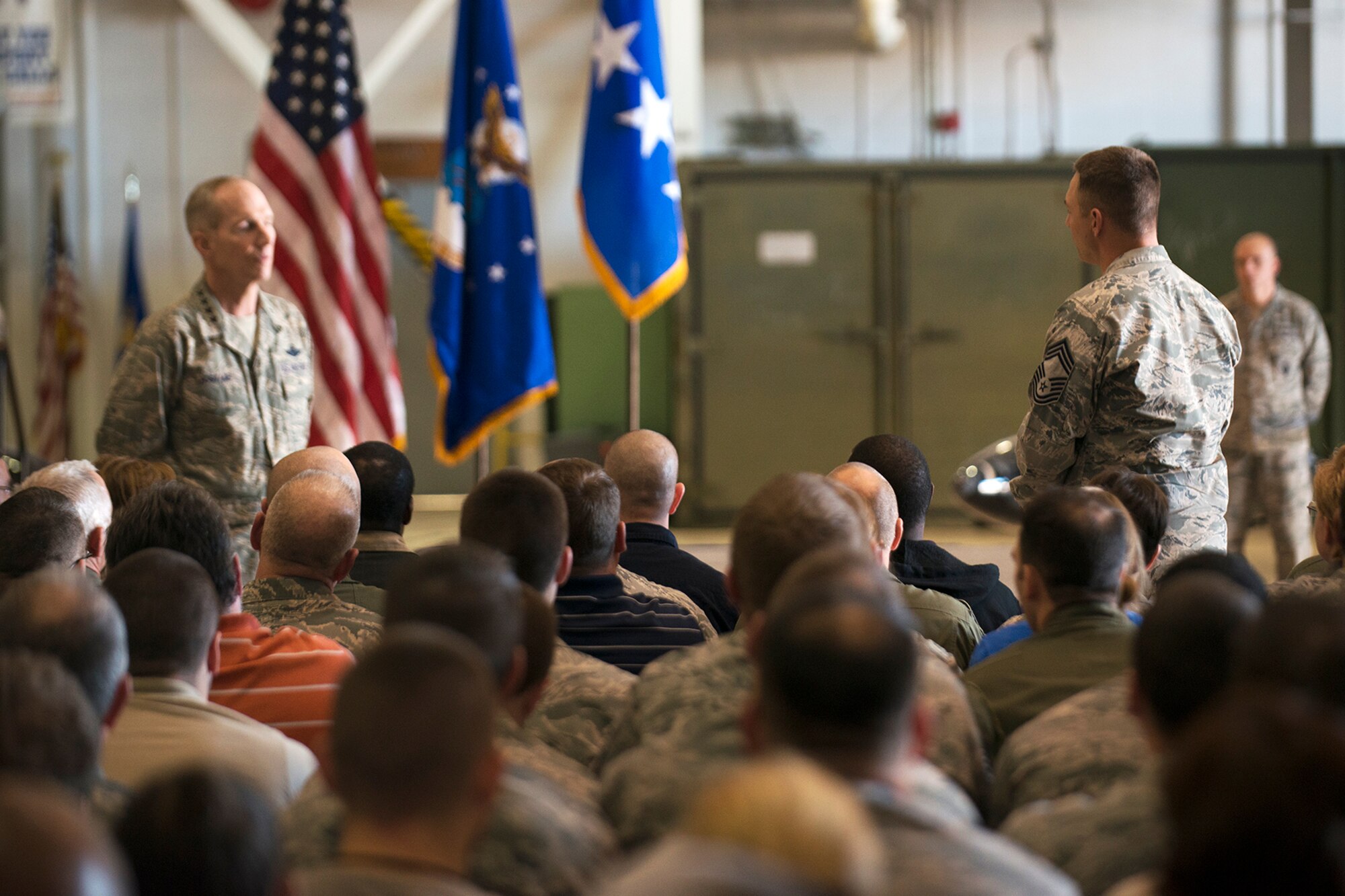 U.S. Air Force Chief Master Sgt. Derek Conrad asks Gen. Michael Hostage a question about the impending budget cuts to the military during a briefing on Jan. 23, 2013, Barksdale Air Force Base, La. Hostage is Commander of the Air Combat Command and visited the 917th Fighter Group, which is scheduled to be deactivated due to changes in the Air Force mission and budget cuts to the military. (U.S. Air Force photo by Master Sgt. Greg Steele/Released)
