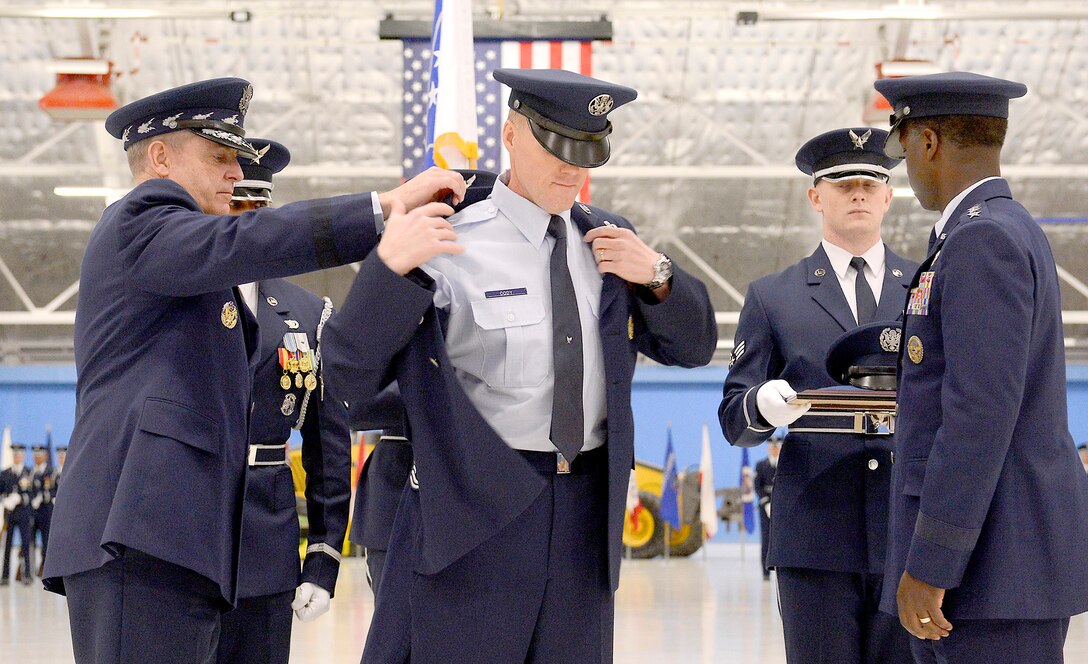 Becoming the 17th person to hold the office, Chief Master Sgt. James Cody receives his service dress coat with his new insignia from Air Force Chief of Staff Gen. Mark A. Welsh III and Gen. Edward A. Rice Jr., commander of Air Education and Training Command, at Joint Base Andrews, Md., on Jan 24, 2013. (U.S. Air Force photo/Scott M. Ash)
