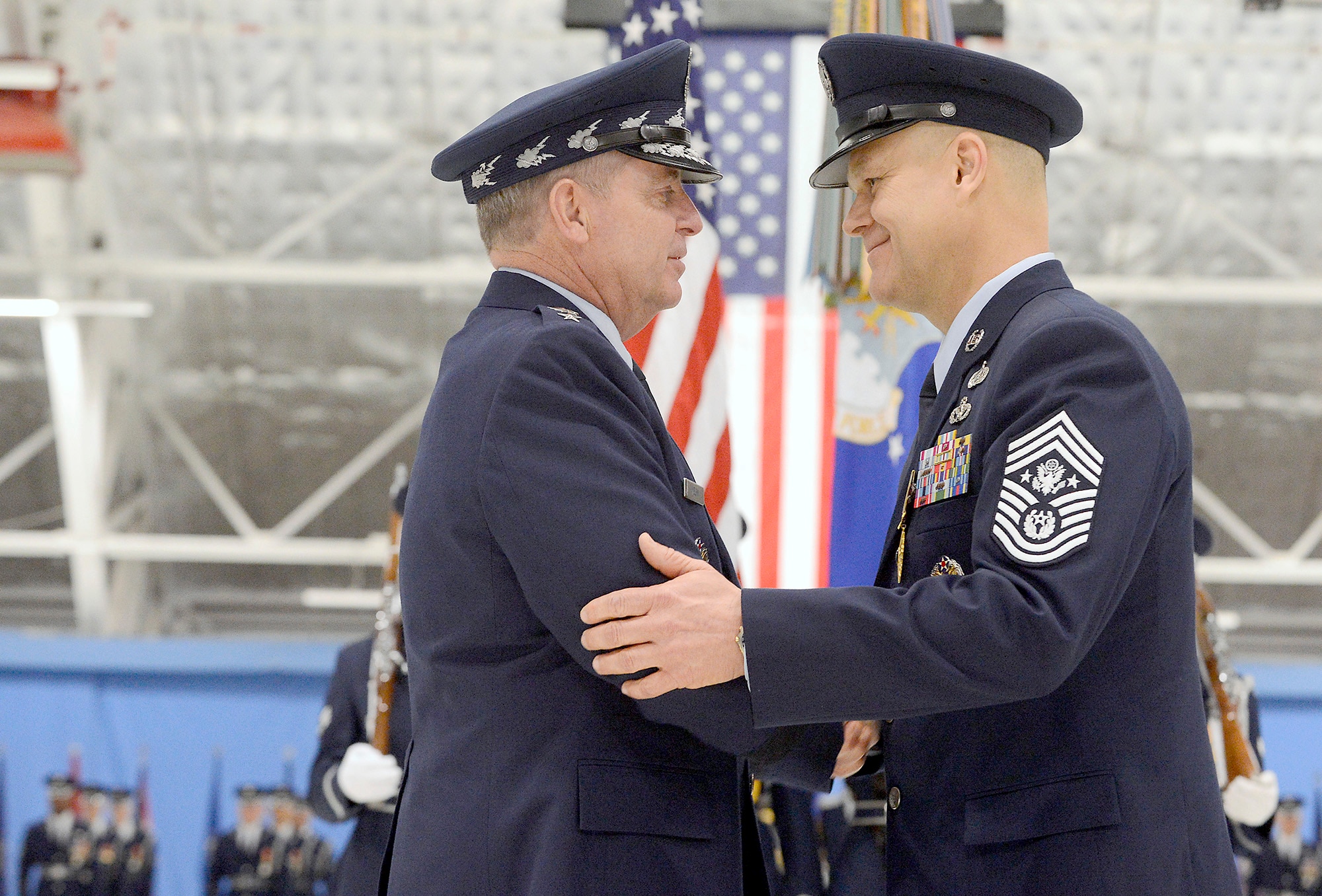 Air Force Chief of Staff Gen. Mark A. Welsh III congratulates Chief Master Sgt. of the Air Force James Roy at Joint Base Andrews, Md., on Jan. 24, 2013, during his retirement ceremony.   (U.S. Air Force photo/Scott M. Ash)