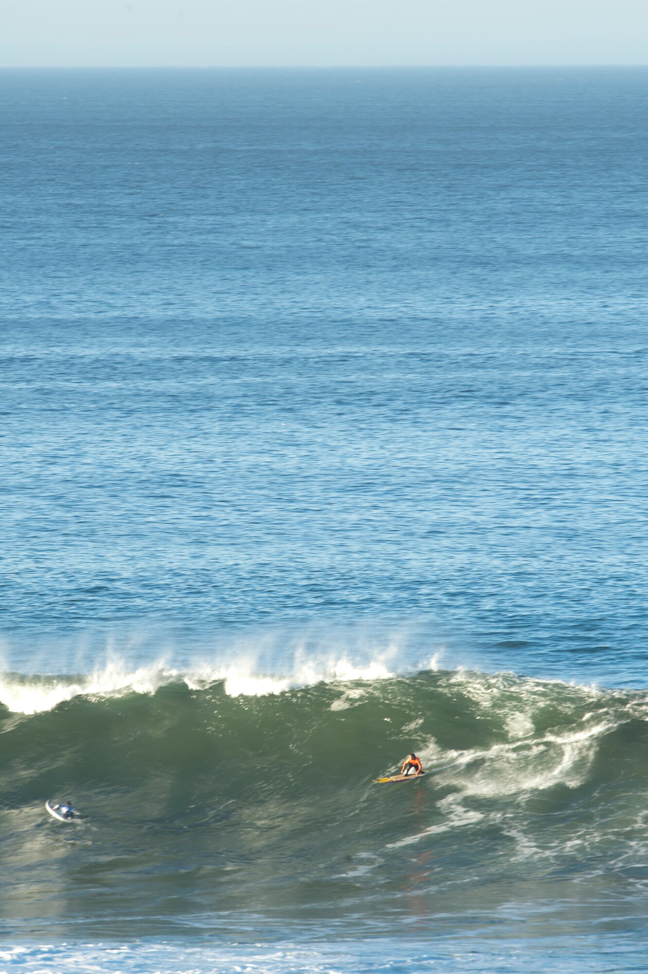 HALF MOON BAY, Calif. – Zach Wormhoudt, Santa Cruzsurfer, races down a wave during the 2013 Mavericks Invitational just north of Half Moon Bay here Sunday, Jan. 20, 2013. Mavericks are world-renowned big wave breaks one and a half miles off the California coastline with waves cresting up to 50 feet, which attract the attention of 24 surfers near and far. (U.S. Air Force photo/Senior Airman Lael Huss)