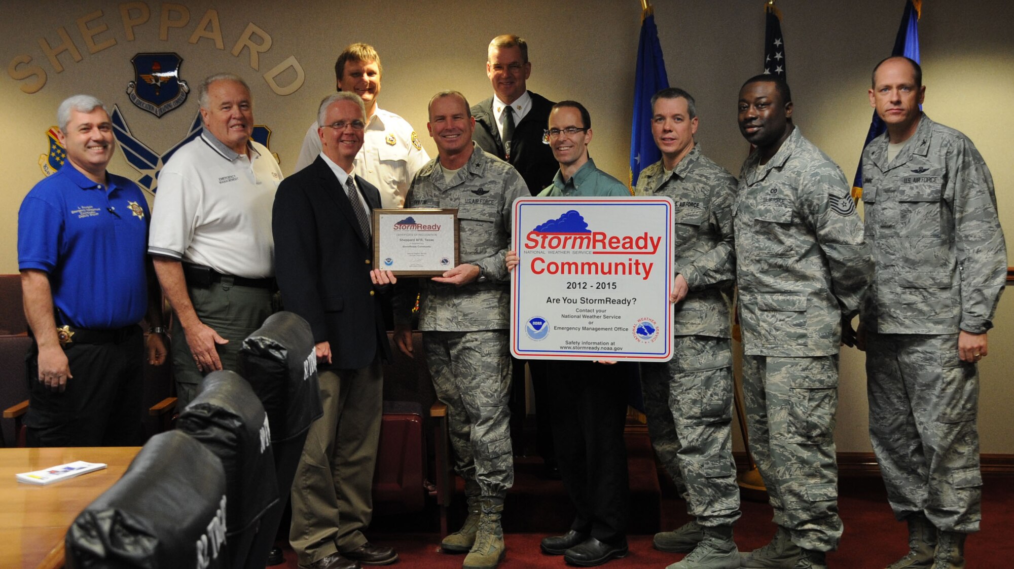 Brigadier General Michael Fantini, base commander of Sheppard Air Force Base, and Jeremy Kirk, an Emergency Management Specialist on base, hold storm readiness awards from the National Weather Service at Sheppard Jan. 24, 2013. Sheppard Air Force Base is the first Air Force installation in Texas to receive a storm readiness award from the NWS. (U.S. Air Force photo by Airman Jelani Gibson)
