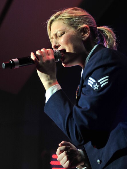 U.S. Air Force Senior Airman Joleen Dedmon, Tops in Blue vocalist, performs during the final set at the Mathis Auditorium, Valdosta, Ga., Jan. 18, 2013. Performers dedicate the final set to honor  the men and women who serve the U.S. by singing patriotic music and ending the show with the Air Force song. (U.S. Air Force photo by Airman Alexis Grotz/Released)