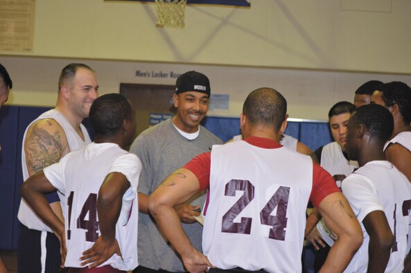 Kenneth Plummer, 802nd Force Support Squadron head coach, talks to his team during a timeout in the regular season opener versus 341st Training Squadron. The FSS won 60-55. (U.S. Air Force Photo/Jose T. Garza)