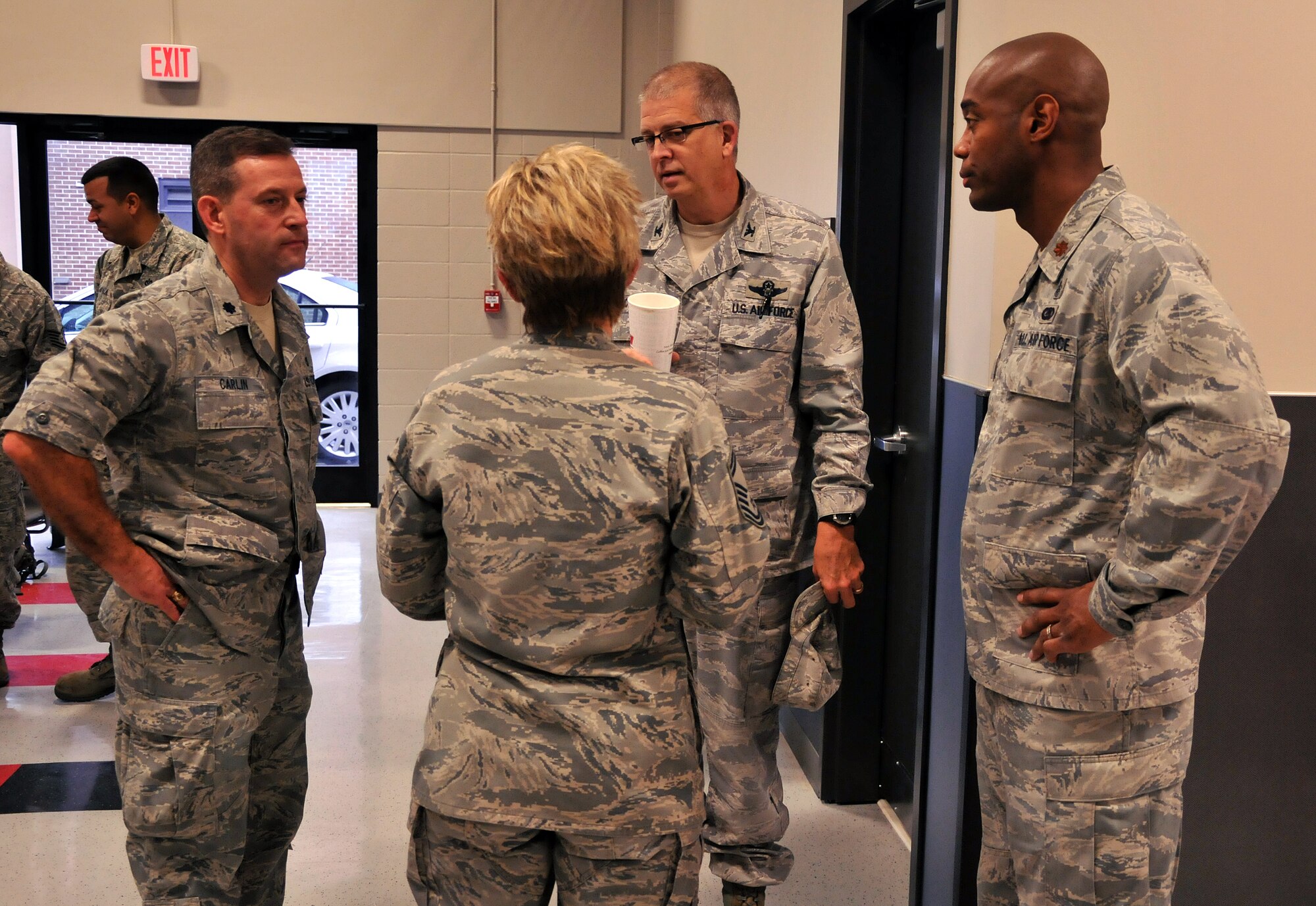 Col. Timothy Tarchick, 94th Airlift Wing commander, Lt. Col. Scott Carlin, 94th Civil Engineering Squadron commander, Maj. Toney Collins, 94th Logistics Readiness Squadron director of operations, and Senior Master Sgt. Joy Hughes, 94th CES senior air Reserve technician, go over the last minute details of the trip to Silver Flag, Jan. 11. Twenty-eight Airmen from the 94th Civil Engineering Squadron departed from Dobbins Air Reserve Base for a Silver Flag exercise at Tyndall Air Force Base, Fla. (U.S. Air Force photo/Senior Airman Elizabeth Van Patten)