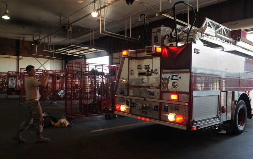Airman 1st Class Juan Rosario, 2nd Civil Engineer Squadron firefighter, guides a fire truck into the fire station on Barksdale Air Force Base, La., Jan. 23. Firefighters must respond at a moment's notice to aircraft and structure fires. (U.S. Air Force photo/Airman 1st Class Benjamin Gonsier)
