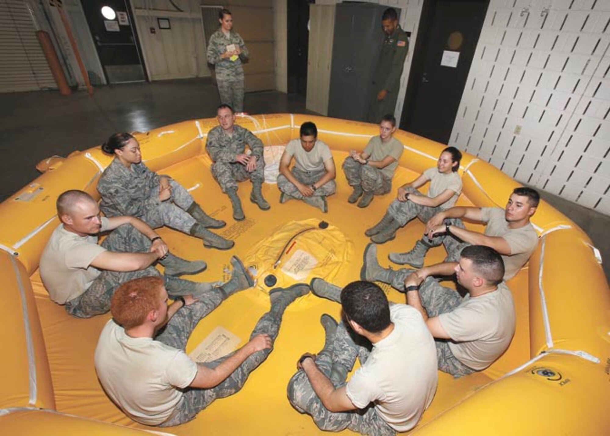 Students in the Basic Flight Attendant Course practice an accountability exercise after a mock ditching emergency procedure. Students in the Basic Flight Attendant Course learn everything from preparing three-course gourmet meals for future top-level passengers to evacuation procedures in case of in-flight emergencies. (Photo by Robbin Cresswell)