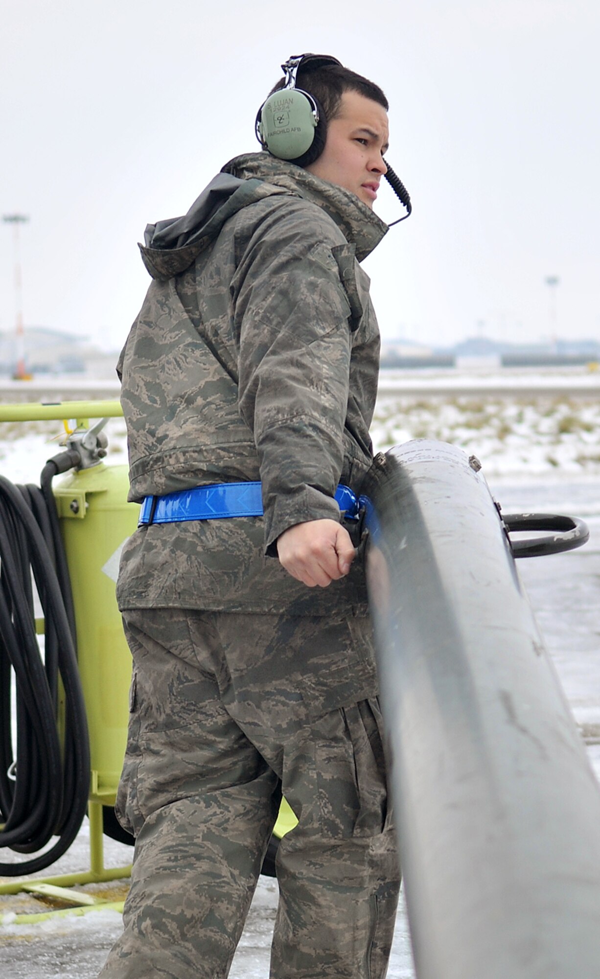 Senior Airman Spencer Lujan, 100th Aircraft Maintenance Squadron crew chief from St. Peters, Mo., positions a tow bar on the flightline Jan. 23, 2013, at RAF Mildenhall, England. Prior to each mission, crew chiefs and other maintenance personnel work together to ensure aircraft are safe and ready to go. (U.S. Air Force photo by Senior Airman Jerilyn Quintanilla/Released)   