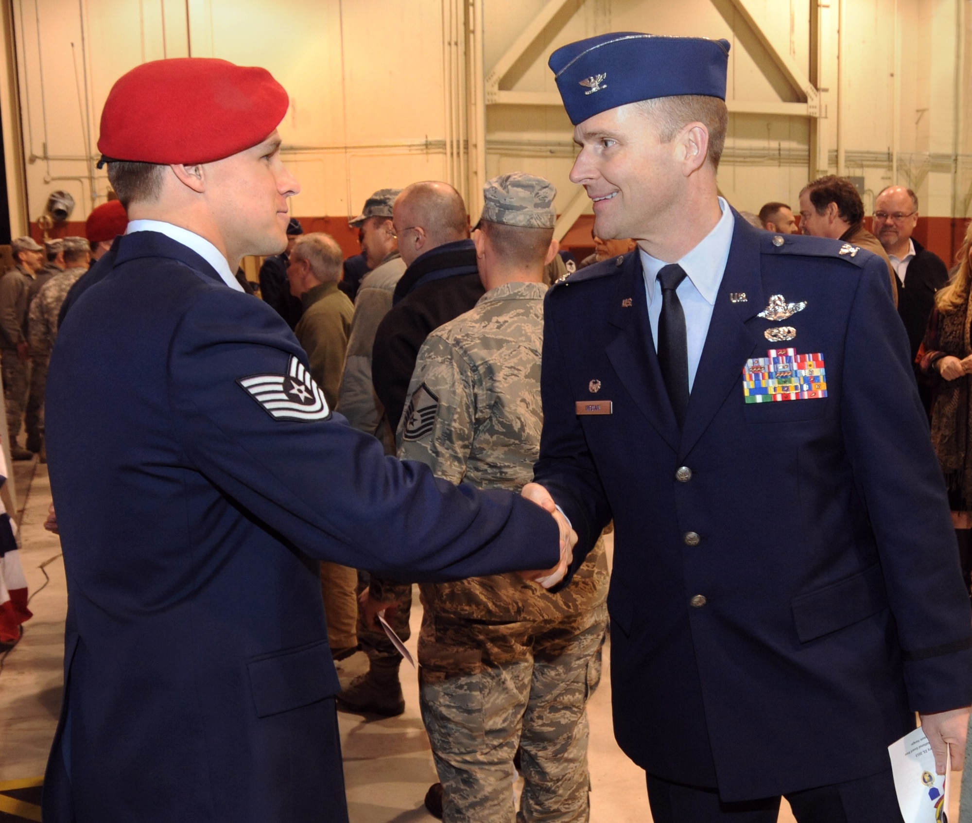 Oregon Air National Guard 142nd Fighter Wing Commander, Col. Rick Wedan, congratulates Tech. Sgt. Douglas J. Matthews, of the 125th Special Tactics Squadron, following his awarding of the Purple Heart Medal at a ceremony held at the Portland Air National Guard Base, Portland, Ore., Jan. 23. Matthews was joined by five of his fellow Airmen, who received Bronze Star Medals earned during recent deployments to the Middle East. U.S. Air Force Lt. Gen. Eric E. Fiel, commander of Air Force Special Operations Command, flew in from his headquarters at Hulburt Field, Fla., for the ceremony. (Oregon Air National Guard by Tech. Sgt. John Hughel, 142nd Fighter Wing Public Affairs/Released)