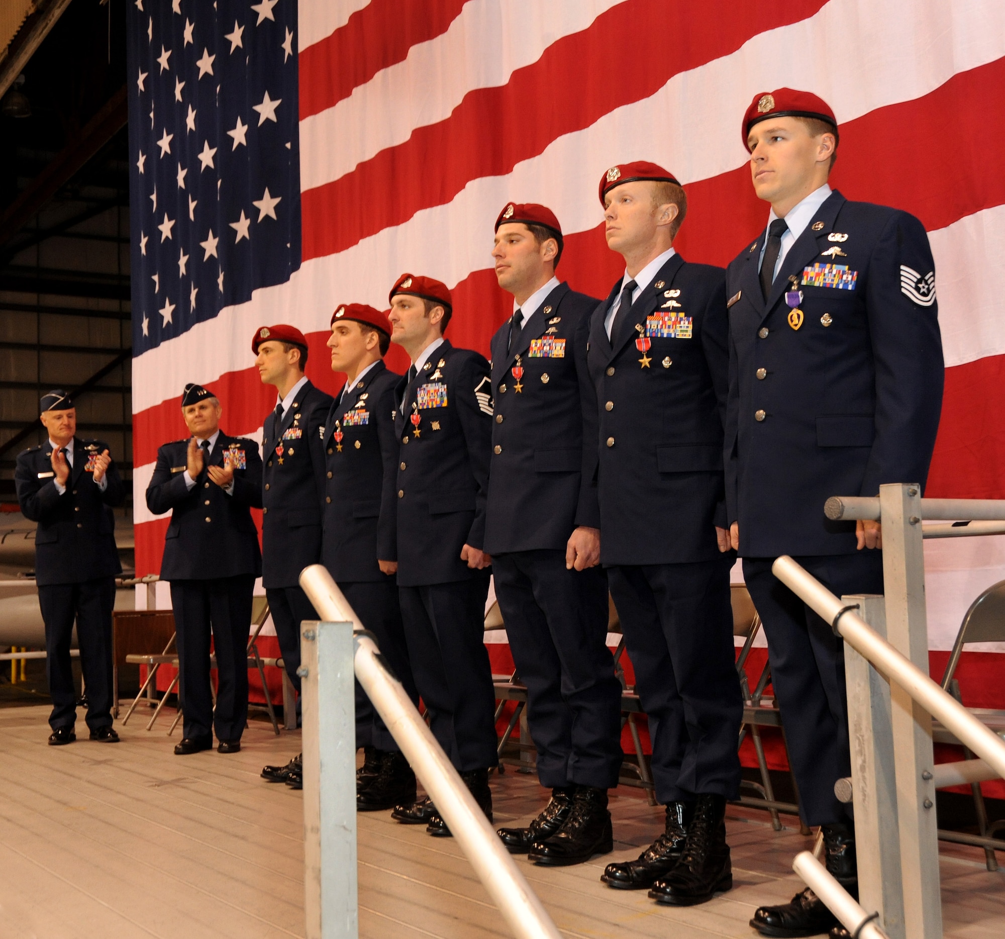 Oregon Air National Guard Brig. Gen. Steven Gregg, commander of the Oregon Air National Guard, and U.S. Air Force Lt. Gen. Eric E. Fiel, commander of Air Force Special Operations Command, applaud Airmen of the 125th Special Tactics Squadron during an award ceremony held at the Portland Air National Guard Base, Portland, Ore., Jan. 23.  The event honored Airmen from the unit with five Bronze Star Medals and one Purple Heart medal.  The Airmen earned the medals during recent deployments to the Middle East. Fiel flew in from AFSOC headquarters at Hulburt Field, Fla., for the ceremony. Left to right are; Staff Sgt. David A. Albright, Senior Airman Chadwick J. Boles, Master Sgt. Scott A. Geisser, Tech. Sgt. Jeffery A. Dolezal, Staff Sgt. Jacob M. Guffy and Tech. Sgt. Douglas J. Matthews. (Oregon Air National Guard by Tech. Sgt. John Hughel, 142nd Fighter Wing Public Affairs/Released)