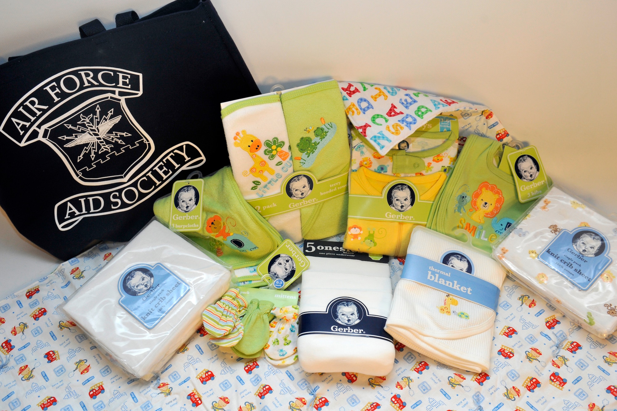 Every other month the Airman and Family Readiness Center provides parents an abundance of information and bundles of baby products to expecting families. The bundles include towels, clothing, baby blankets, bibs, bedding and a tote bag sponsored by the Air Force Aid Society. (U.S. Air Force photo by Airman 1st Class Riley Johnson/Released)