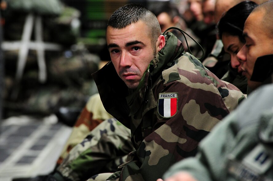 A French soldier relaxes inside a U.S. Air Force C-17 Globemaster III while in route to Mali as France increases their presence in the African nation to fight off extremists that have taken control of much of Northern Mali Jan. 20, 2013. The United States has agreed to support France by airlifiting troops and equipment to Mali. (U.S. Air Force photo/Senior Airman James Richardson)