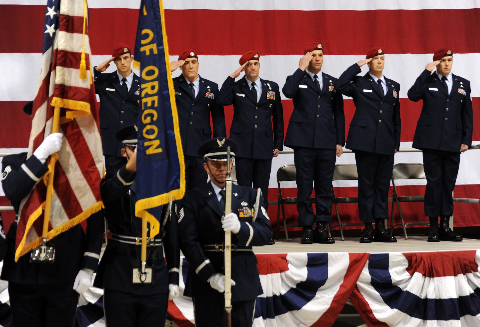 Members of the Oregon Air National Guard's 125th Special Tactics Squadron salute the honor guard during the posting of colors at a ceremony held at the Portland Air National Guard Base, Portland, Ore., Jan. 23. The ceremony was to honor the group with five Bronze Star Medals and one Purple Heart medal.  The Airmen earned the medals during recent deployments to the Middle East.  From left to right are; Staff Sgt. David A. Albright, Senior Airman Chadwick J. Boles, Master Sgt. Scott A. Geisser, Tech. Sgt. Jeffery A. Dolezal, Staff Sgt. Jacob M. Guffy and Tech. Sgt. Douglas J. Matthews. U.S. Air Force Lt. Gen. Eric E. Fiel, commander of Air Force Special Operations Command, flew in from his headquarters at Hulburt Field, Fla., for the ceremony.  (Oregon Air National Guard photo by Tech. Sgt. John Hughel, 142nd Fighter Wing Public Affairs/Released)
