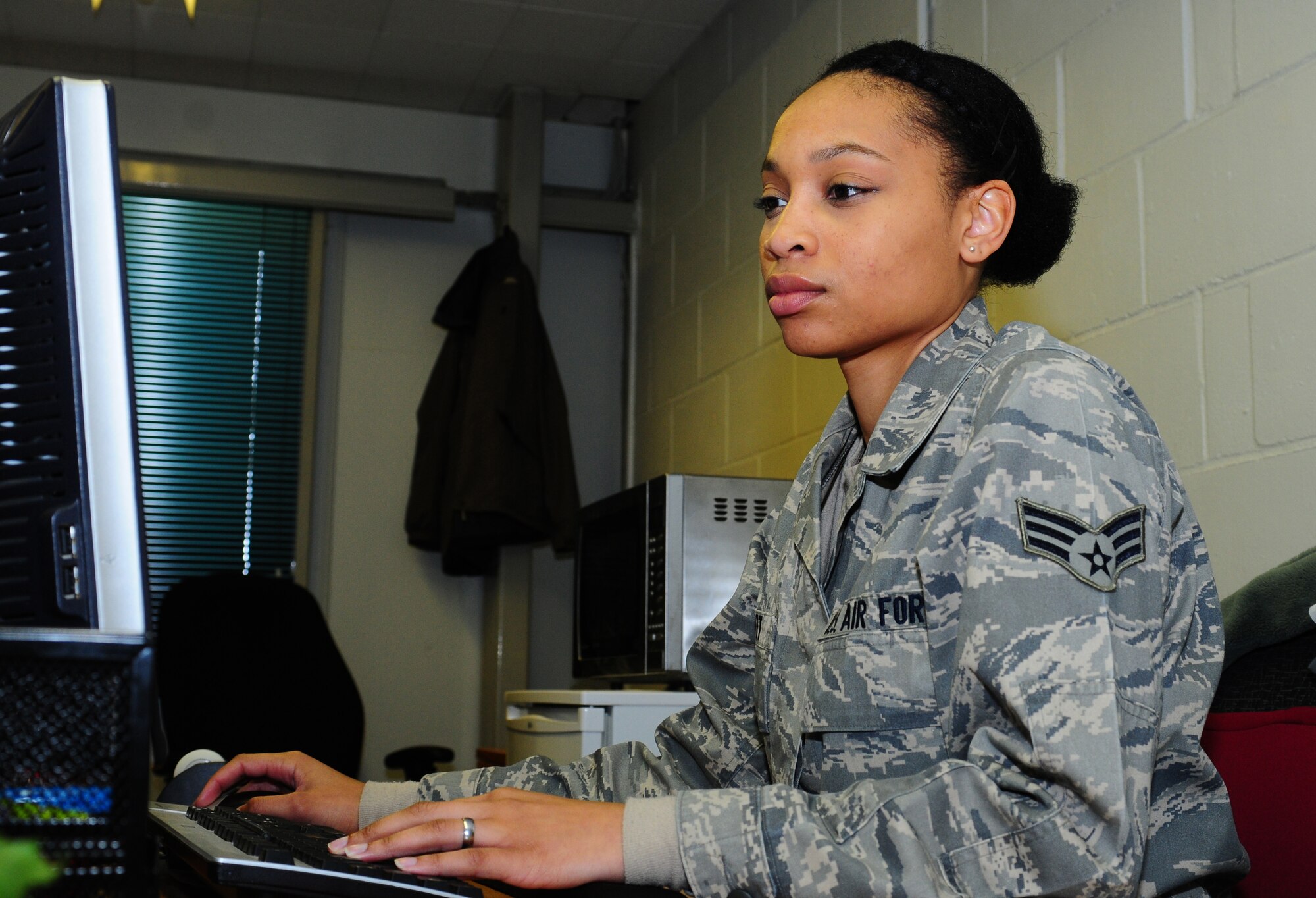 ROYAL AIR FORCE LAKENHEATH, England -- Senior Airman Kelsey Scott, 48th Communications Squadron base software license manager and personal wireless communication systems alternate, modifies a user profile Jan. 24, 2013. Scott was nominated for a Liberty Spotlight because she displays the core value of "Excellence in All We Do." (U.S. Air Force photo by Airman 1st Class Dana J. Butler)

