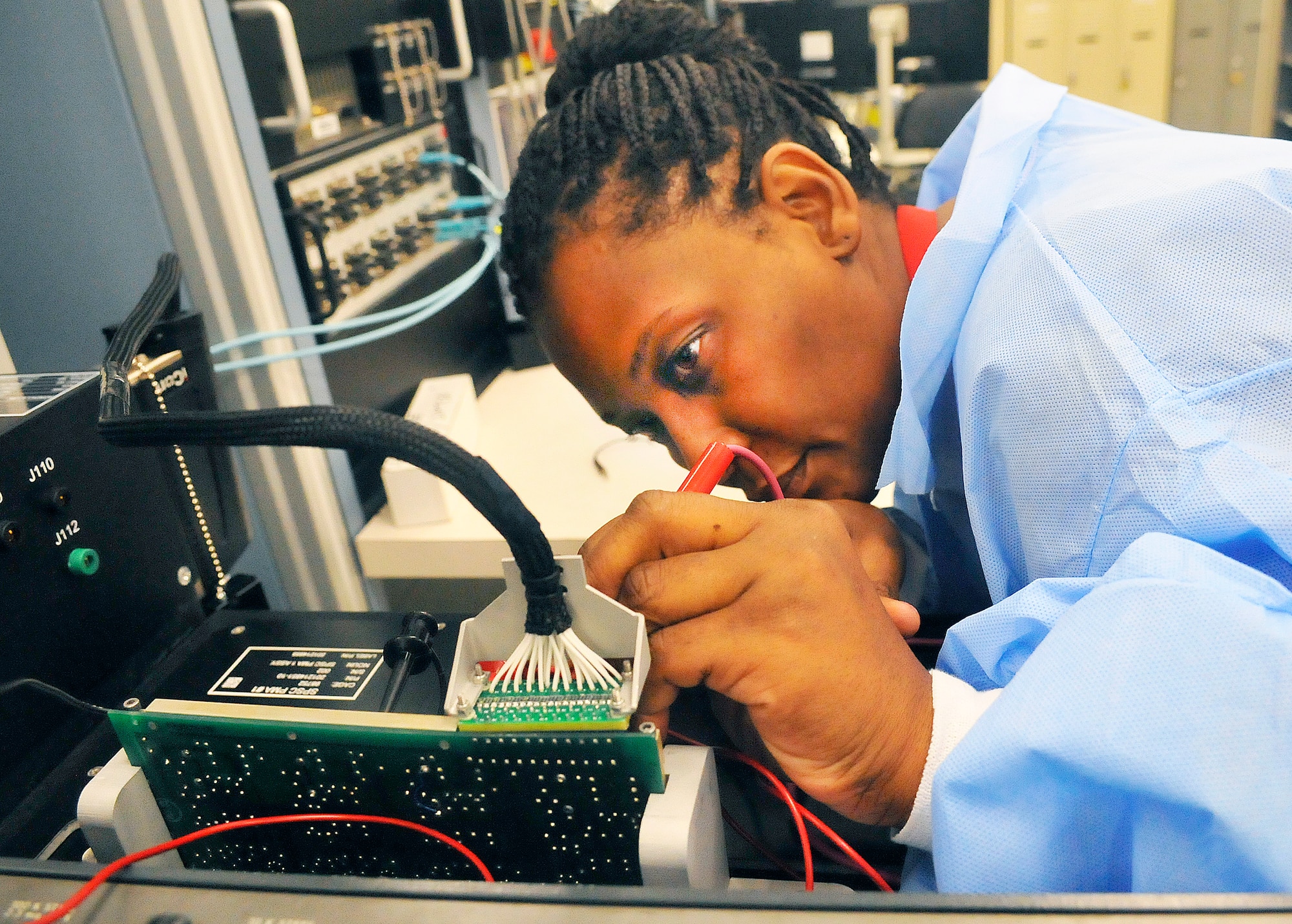 Jamie Loyd, electronics technician, probes a circuit card while running a diagnostic program. (U. S. Air Force photo/Sue Sapp)
