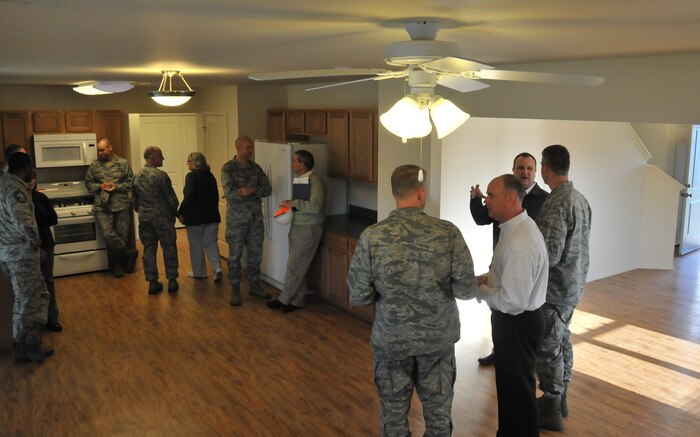Base leadership tours the kitchen of a new house , Jan. 23, 2013 at JB Charleston – Air Base, S.C. Forest City, the privatized housing company at JB Charleston, recently completed Phase Four of the new housing development. Currently, 265 homes have been built and are available to families. (U.S. Air Force photo/ Airman 1st Class Jared Trimarchi)