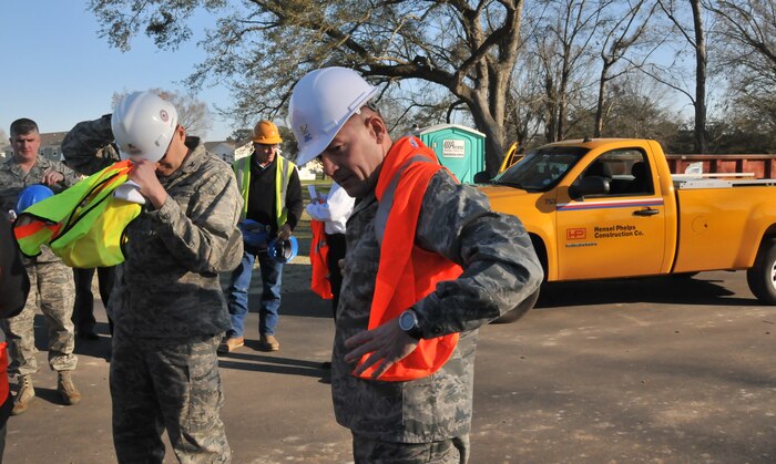 Col. Richard McComb, Joint Base Charleston commander, dons his protective equipment before touring the new community center, which is still under construction, Jan. 23, 2013 at JB Charleston – Air Base, S.C. Forest City, the privatized housing company at JB Charleston, recently completed phase four of the new housing development. Currently, 265 homes have been built and are available to military members and their families. (U.S. Air Force photo/ Airman 1st Class Jared Trimarchi)