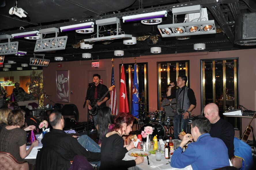 Alternative pop and rock band Adam's Attic performed at the Izmir Club to a crowd of more than 100 Jan. 18, 2013, at Izmir Air Base, Turkey. The band gave performances at Izmir and Incirlik as part of an Armed Forces Entertainment tour, which provides entertainment for service members, civilians and their families stationed overseas. (U.S. Air Force photo by Tanju Varlikli/Released)