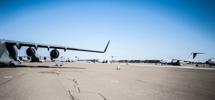 A group effort was put to the test Jan. 13, 2013 at Joint Base Charleston - Air Base after a late-night emergency medical flight used a closed section of the air field. The Joint Base Charleston – Air Base air field is the first operational C-17A wing in the Air Force. The wing’s current fleet of aircraft is valued at more than $11.5 billion dollars and has broken more than 33 world records, including payload to altitude, time to climb and short takeoff and landing marks. (U.S. Air Force photo / Airman 1st Class Tom Brading) 