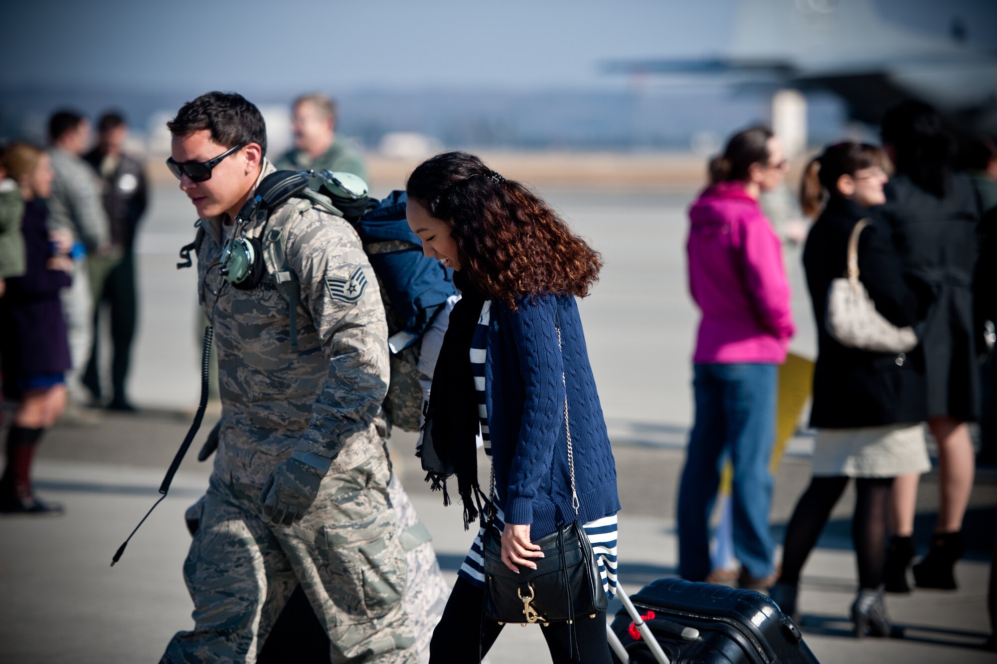 Staff Sgt. Aaron Wermy, 374th Aircraft Maintenance Squadron crew chief, is welcomed by his girlfriend, Sayaka Ohayama, at Yokota Air Base, Japan, Jan. 24, 2013. Wermy and other Yokota members were greeted by family and friends after a four-month deployment to Southwest Asia. (U.S. Air Force photo by Senior Airman Cody H. Ramirez)