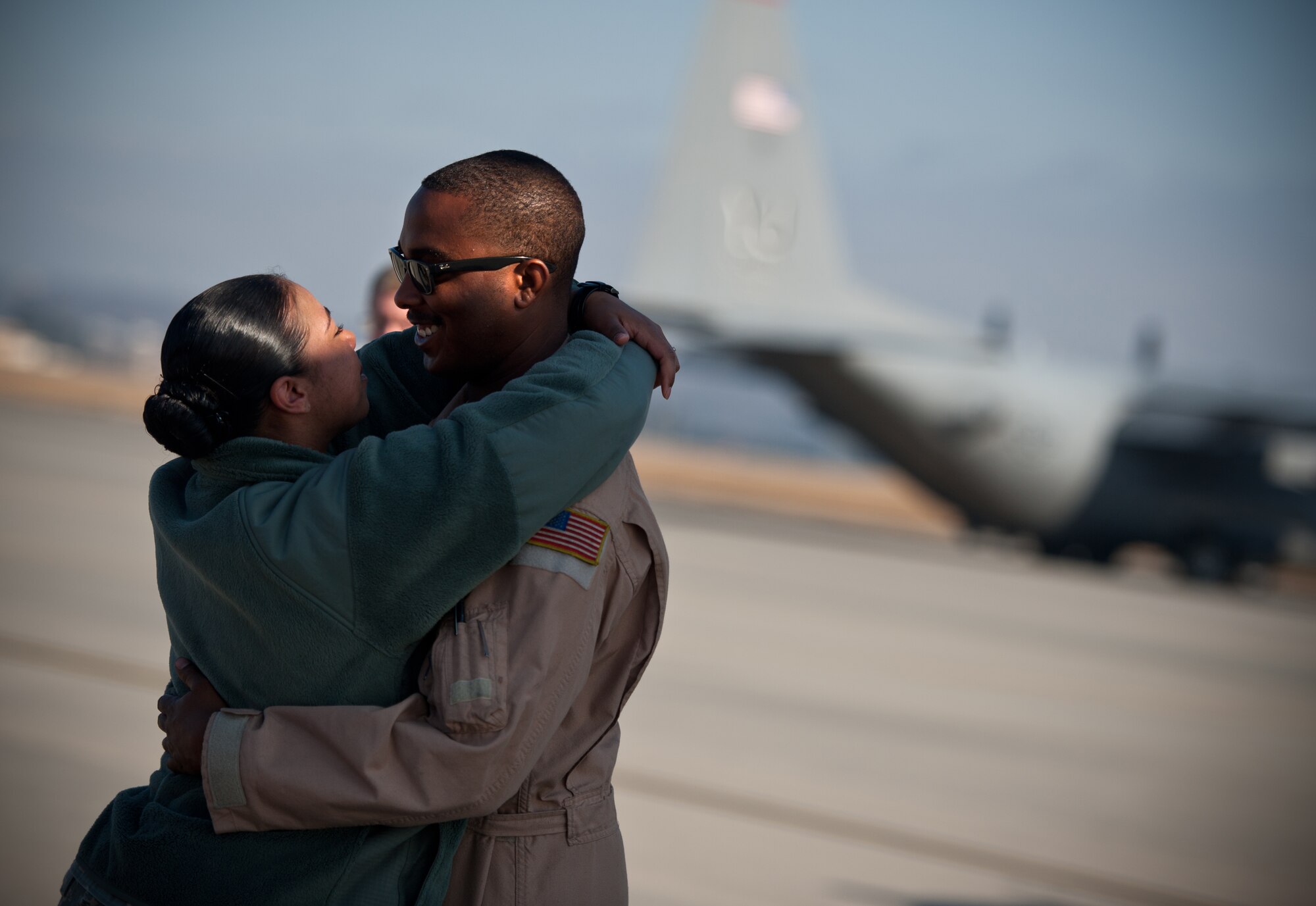 Staff Sgt. Byron Simon is reunited with his wife, Nakisha, at Yokota Air Base, Japan, Jan. 24, 2013, after a four-month deployment to Southwest Asia.  Bryon is a flight engineer with the 36th Airlift Squadron. Nakisha is a staff sergeant with the 374th Aerospace Medicine Squadron. (U.S. Air Force photo by Senior Airman Cody H. Ramirez)
