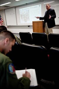 An instructor from the Air Advisor Academy teaches adviser principles to students during a course at Yokota Air Base, Japan, Jan. 16, 2013. Twenty Yokota members attended the five-day course to learn partnership-building skills. (U.S. Air Force photo by Senior Airman Cody H. Ramirez)
