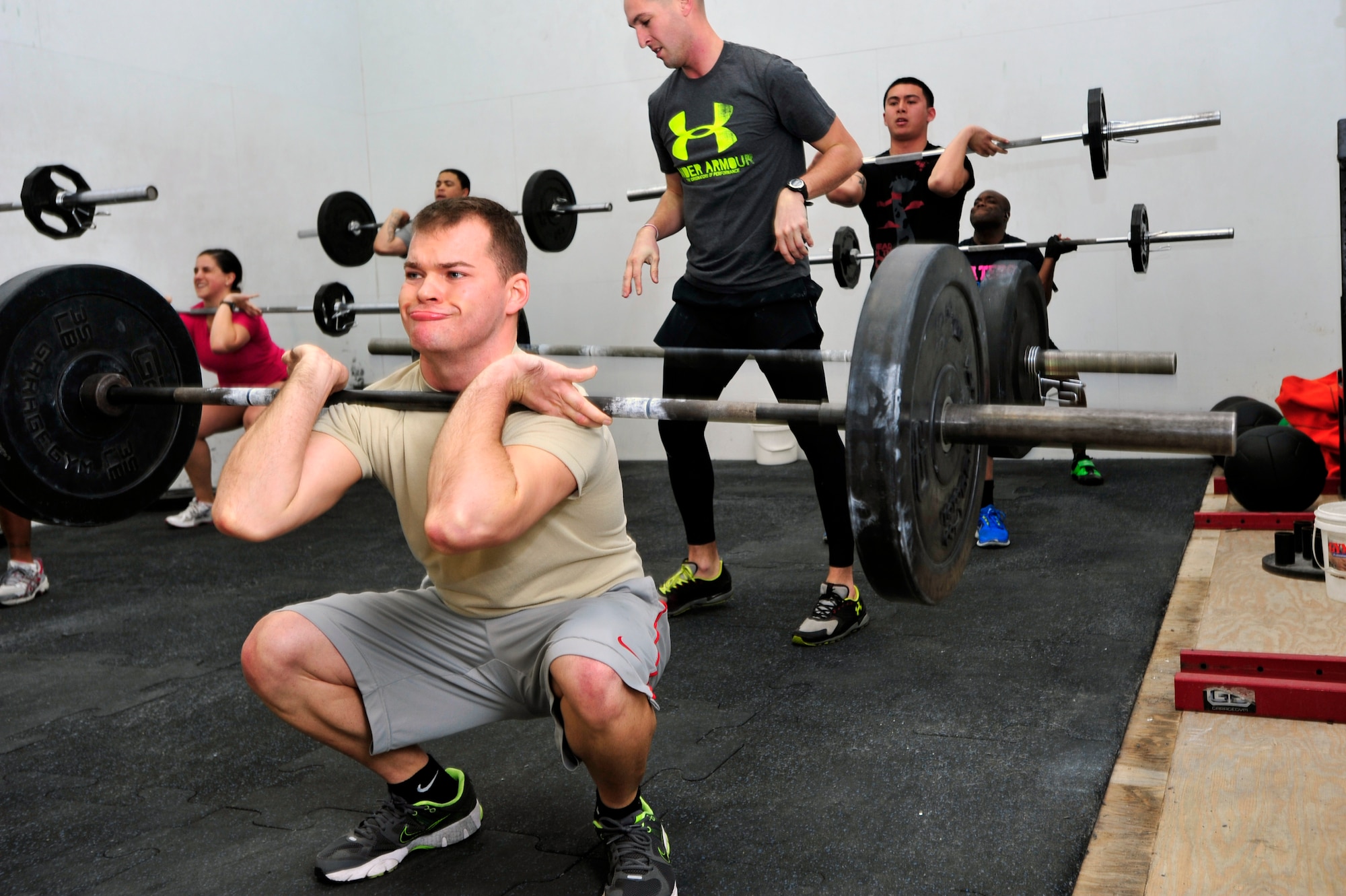 Senior Airman Marshal Hunsaker, 51st Fighter Wing Public Affairs videographer, participates in a Crossfit workout at the Osan Fitness Center Dec. 18, 2012. Participants work at their own pace to achieve their best time while competing with other classmates. (U.S. Air Force photo/Airman 1st Class Alexis Siekert)
