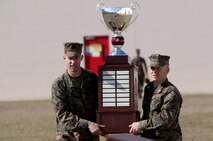 Marines with 2nd Maintenance Battalion, Combat Logistics Regiment 25, 2nd Marine Logistics Group carry the Chesty Puller Award during a ceremony aboard Camp Lejeune, N.C., Jan. 23, 2013. The award recognized the unit for displaying suburb force preservation and superior performance both on and off duty. 