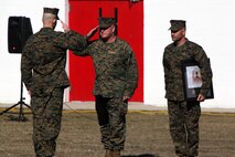 Lt. Col. Craig C. Clemans (left), the commanding officer of 2nd Maintenance Battalion, Combat Logistics Regiment 25, 2nd Marine Logistics Group, salutes Maj. Gen. Raymond C. Fox (center), the commanding general of II Marine Expeditionary Force, as the general presents the battalion with the Chesty Puller Award for outstanding leadership aboard Camp Lejeune, N.C., Jan. 23, 2013. The unit was selected for the award for displaying uncanny force preservation and superior performance both on and off duty.