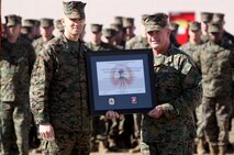 Lt. Col. Craig C. Clemans (left), the commanding officer of 2nd Maintenance Battalion, Combat Logistics Regiment 25, 2nd Marine Logistics Group, poses for a picture after receiving the Chesty Puller Award from Maj. Gen. Raymond C. Fox [right], the commanding general of II Marine Expeditionary Force, aboard Camp Lejeune, N.C., Jan. 23, 2013. The award recognizes units for outstanding leadership and support of II MEF operations. 