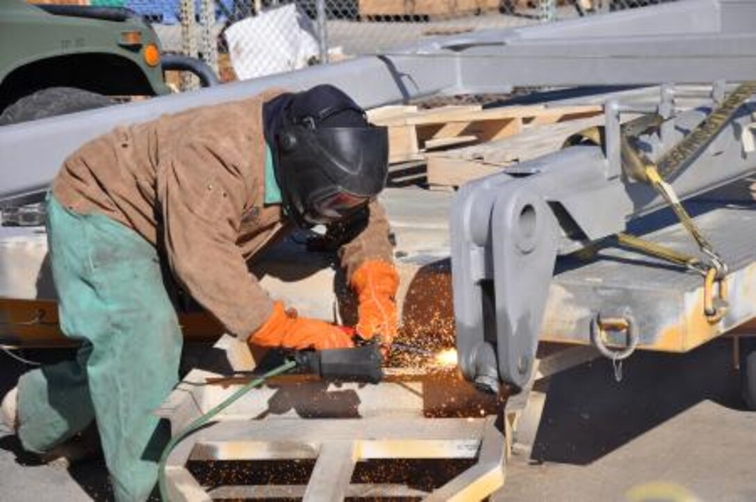 Robert Hoskin, a welder at Production Plant Barstow, Marine Depot Maintenance Command lances a pin on an LAV frame, Jan. 11. Hoskin travels across PPB performing multiple welding jobs.