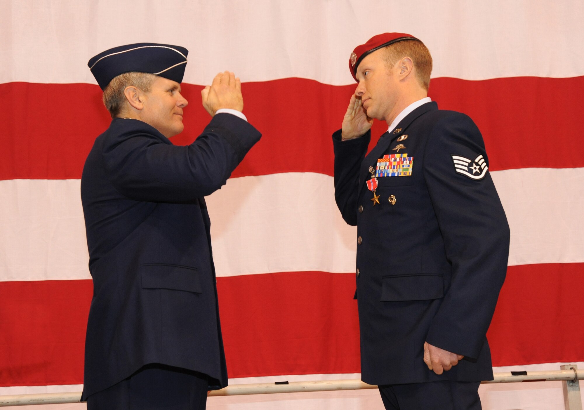 U.S. Air Force Lt. Gen. Eric E. Feil, commander of Air Force Special Operations Command, salutes Staff Sgt. Jacob M. Guffey of the 125th Special Tactics Squadron after he received his Bronze Star Medal during an award ceremony held at the Portland Air National Guard Base, Portland, Ore., Jan. 23.  The event honored Airmen from the unit with five Bronze Star Medals and one Purple Heart medal.  The Airmen earned the medals during recent deployments to the Middle East. Fiel flew in from AFSOC headquarters at Hulburt Field, Fla., for the ceremony (U.S. Air Force photo by Tech. Sgt. John Hughel, 142nd Fighter Wing Public Affairs/Released)