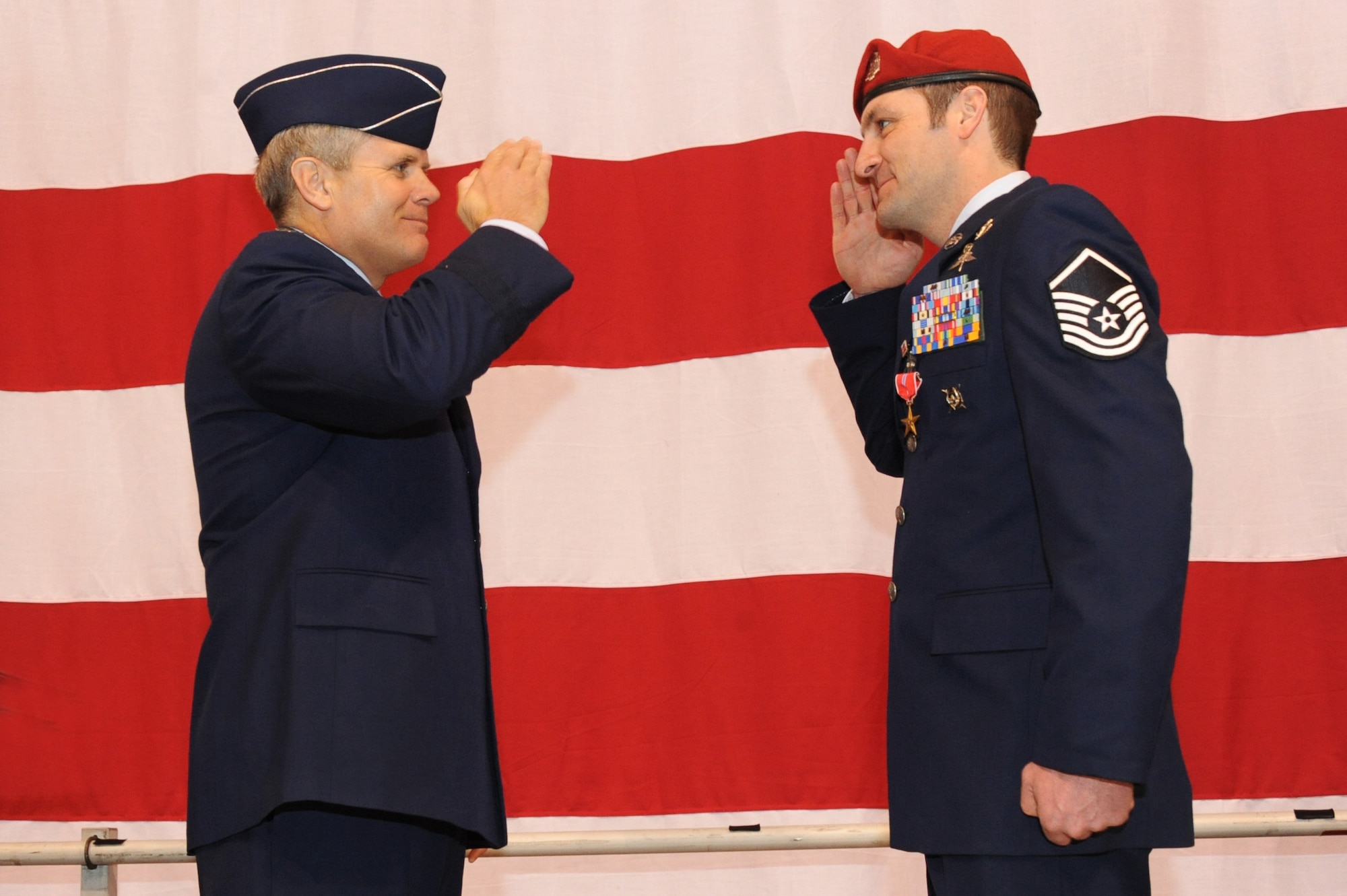 U.S. Air Force Lt. Gen. Eric E. Feil, commander of Air Force Special Operations Command, salutes Master Sgt. Scott A. Geisser of the 125th Special Tactics Squadron after he received his Bronze Star Medal during an award ceremony held at the Portland Air National Guard Base, Portland, Ore., Jan. 23.  The event honored Airmen from the unit with five Bronze Star Medals and one Purple Heart medal.  The Airmen earned the medals during recent deployments to the Middle East. Fiel flew in from AFSOC headquarters at Hulburt Field, Fla., for the ceremony (U.S. Air Force photo by Tech. Sgt. John Hughel, 142nd Fighter Wing Public Affairs/Released)