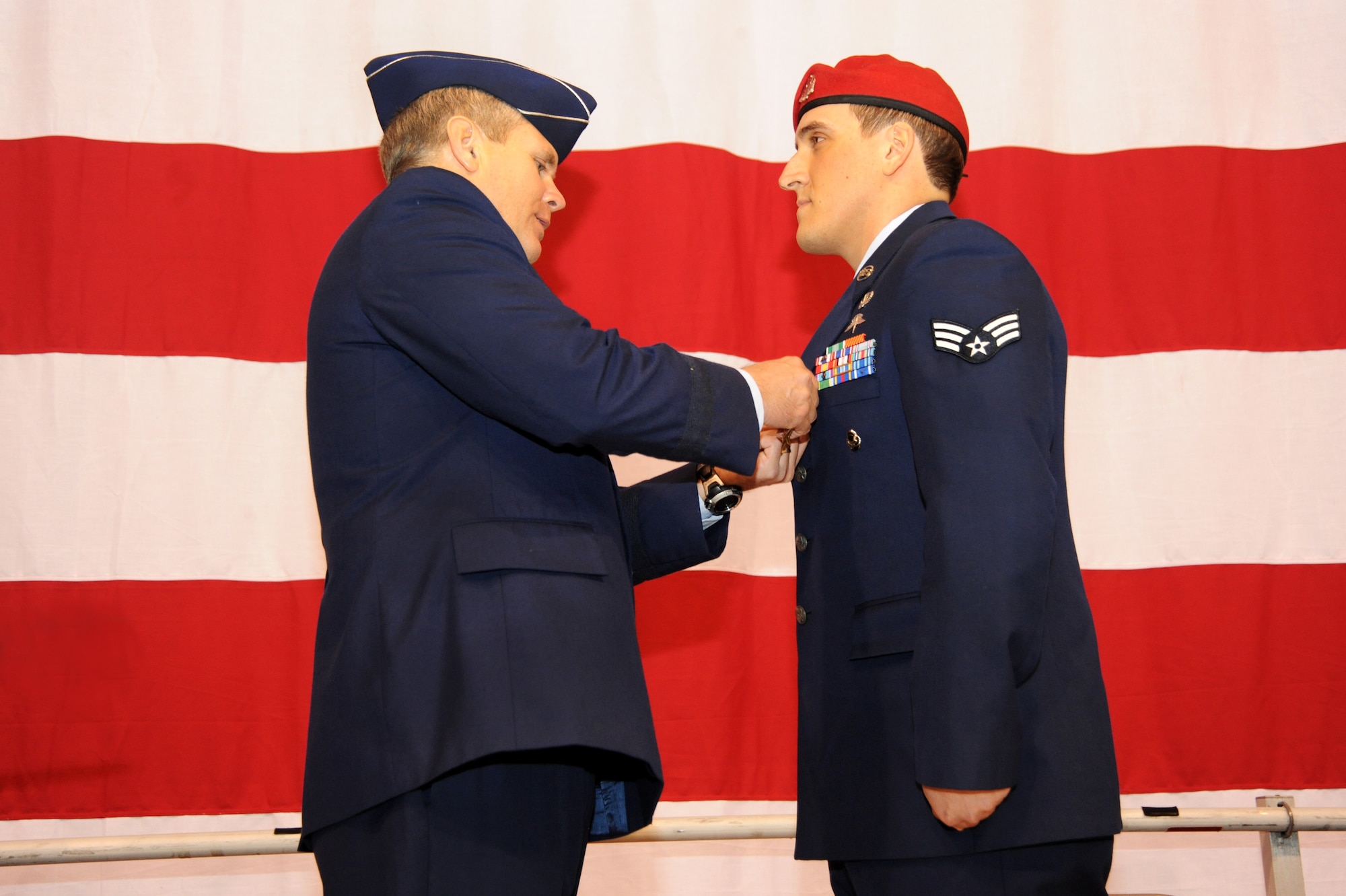 U.S. Air Force Lt. Gen. Eric E. Feil, commander of Air Force Special Operations Command, awards the Bronze Star Medal to Senior Airman Chadwick J. Boles of the 125th Special Tactics Squadron during an award ceremony held at the Portland Air National Guard Base, Portland, Ore., Jan. 23.  The event honored Airmen from the unit with five Bronze Star Medals and one Purple Heart medal.  The Airmen earned the medals during recent deployments to the Middle East. Fiel flew in from AFSOC headquarters at Hulburt Field, Fla., for the ceremony (U.S. Air Force photo by Tech. Sgt. John Hughel, 142nd Fighter Wing Public Affairs/Released)