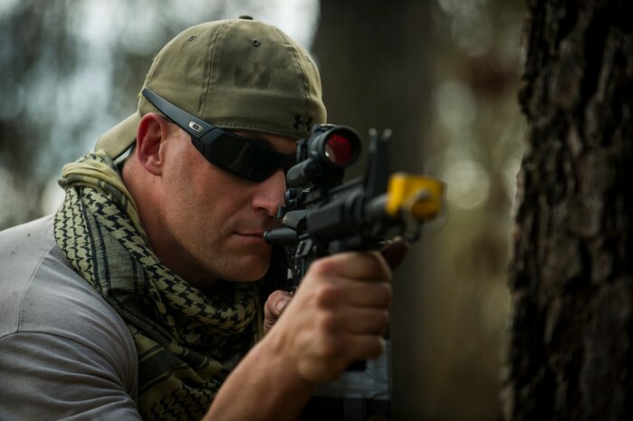 Master Sgt. Mark Peters, 1st Combat Camera Squadron first sergeant, acts as opposing forces, during the Ability to Survive and Operate exercise Jan. 16, 2013, at North Auxiliary Air Field, S.C. Combat Camera held the exercise to train Airmen to function outside the wire as combat documentation specialists. The week-long exercise began Jan. 7 and ended Jan. 18. The 1st CTCS acquires still and motion imagery in support of classified and unclassified air, sea and ground military operations. (U.S. Air Force photo/Senior Airman George Goslin)