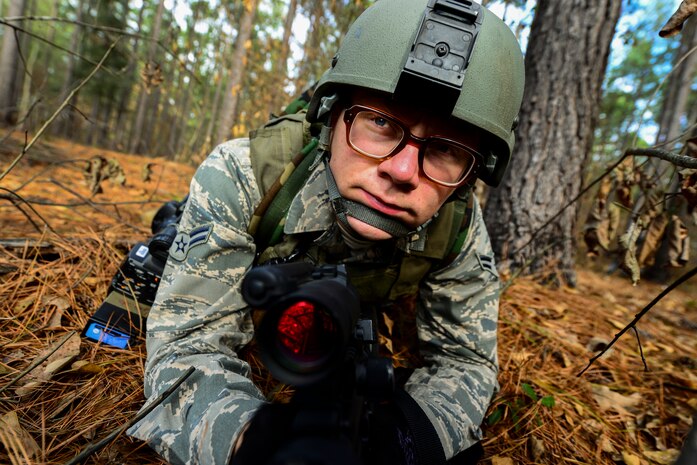 Airman 1st Class Eric Mann, 1st Combat Camera Squadron broadcaster, posts security during the Ability to Survive and Operate exercise Jan. 16, 2013, at North Auxiliary Air Field, S.C. Combat Camera held the exercise to train Airmen to function outside the wire as combat documentation specialists. The week-long exercise began Jan. 7 and ended Jan. 18. The 1st CTCS acquires still and motion imagery in support of classified and unclassified air, sea and ground military operations. (U.S. Air Force photo/Senior Airman George Goslin)