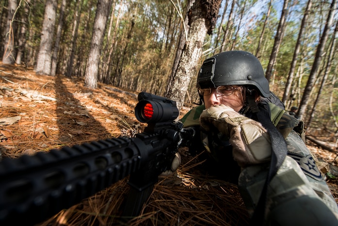 Staff Sgt. Michelle Demers, 1st Combat Camera Squadron combat broadcaster, hydrates during the Ability to Survive and Operate exercise Jan. 16, 2013, at North Auxiliary Air Field, S.C. Combat Camera held the exercise to train Airmen to function outside the wire as combat documentation specialists. The week-long exercise began Jan. 7 and ran through Jan. 18. The 1st CTCS acquires still and motion imagery in support of classified and unclassified air, sea and ground military operations. (U.S. Air Force photo/Senior Airman George Goslin)