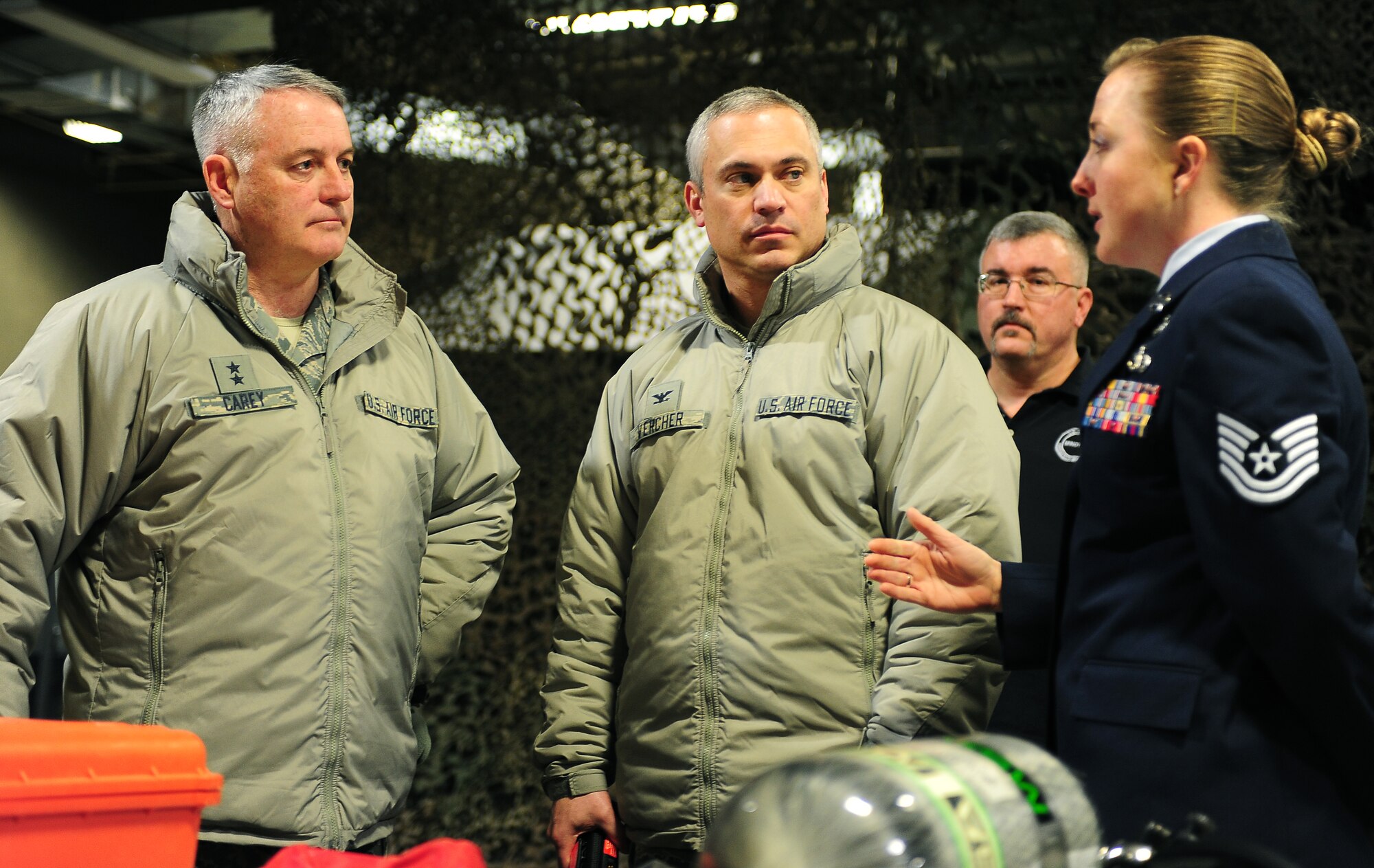 MINOT AIR FORCE BASE, N.D. -- Maj. Gen. Michael Carey, 20th Air Force commander (left) and Colonel Robert Vercher, 91st Missile Wing Commander (center), receive a briefing from Tech Sgt. Johnnie Sterling, NCOIC Emergency Management, during a recent visit with the 5th Bomb Wing and the 91st Missile Wing here, Jan. 24. Twentieth Air Force is responsible for maintaining and operating the Air Force's ICBM force. Designated as U.S. Strategic Command's Task Force 214, 20th AF provides on-alert; combat ready ICBMs to the President of the United States. (U.S. Air Force photo/Airman 1st Class Kristoffer Kaubisch)