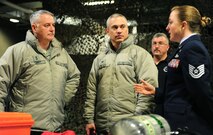 MINOT AIR FORCE BASE, N.D. -- Maj. Gen. Michael Carey, 20th Air Force commander (left) and Colonel Robert Vercher, 91st Missile Wing Commander (center), receive a briefing from Tech Sgt. Johnnie Sterling, NCOIC Emergency Management, during a recent visit with the 5th Bomb Wing and the 91st Missile Wing here, Jan. 24. Twentieth Air Force is responsible for maintaining and operating the Air Force's ICBM force. Designated as U.S. Strategic Command's Task Force 214, 20th AF provides on-alert; combat ready ICBMs to the President of the United States. (U.S. Air Force photo/Airman 1st Class Kristoffer Kaubisch)