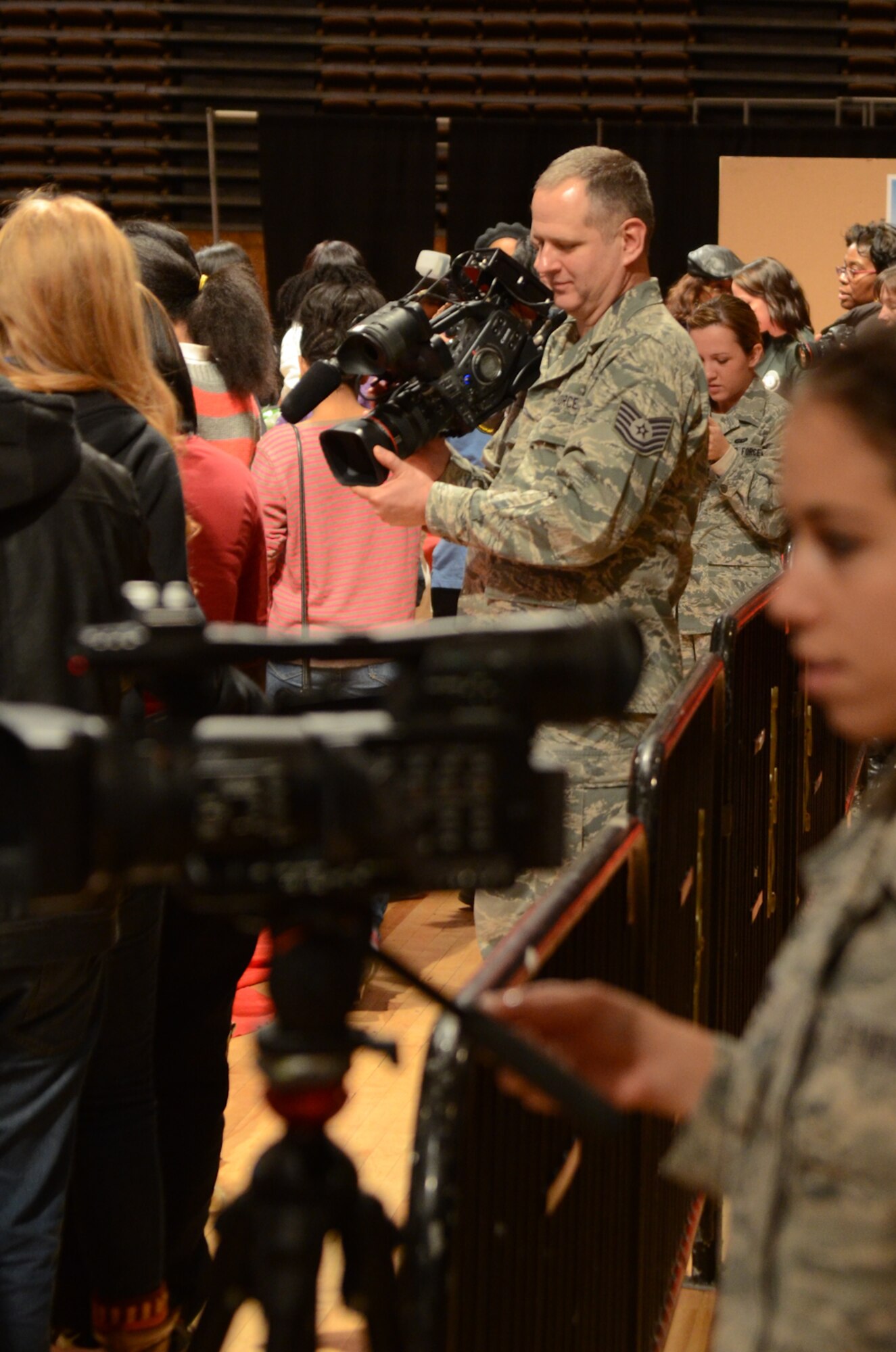 Tech. Sgt. Kevin Coulter, a combat correspondent from the Colorado Air National Guard, documents events at the District of Columbia National Guard Armory in Washington, D.C., Jan. 19, 2013. Public Affairs Guardsmen from across the country are deployed in support of the 57th Presidential Inauguration. (U.S. Air Force photo/Tech. Sgt. Michael Crane)