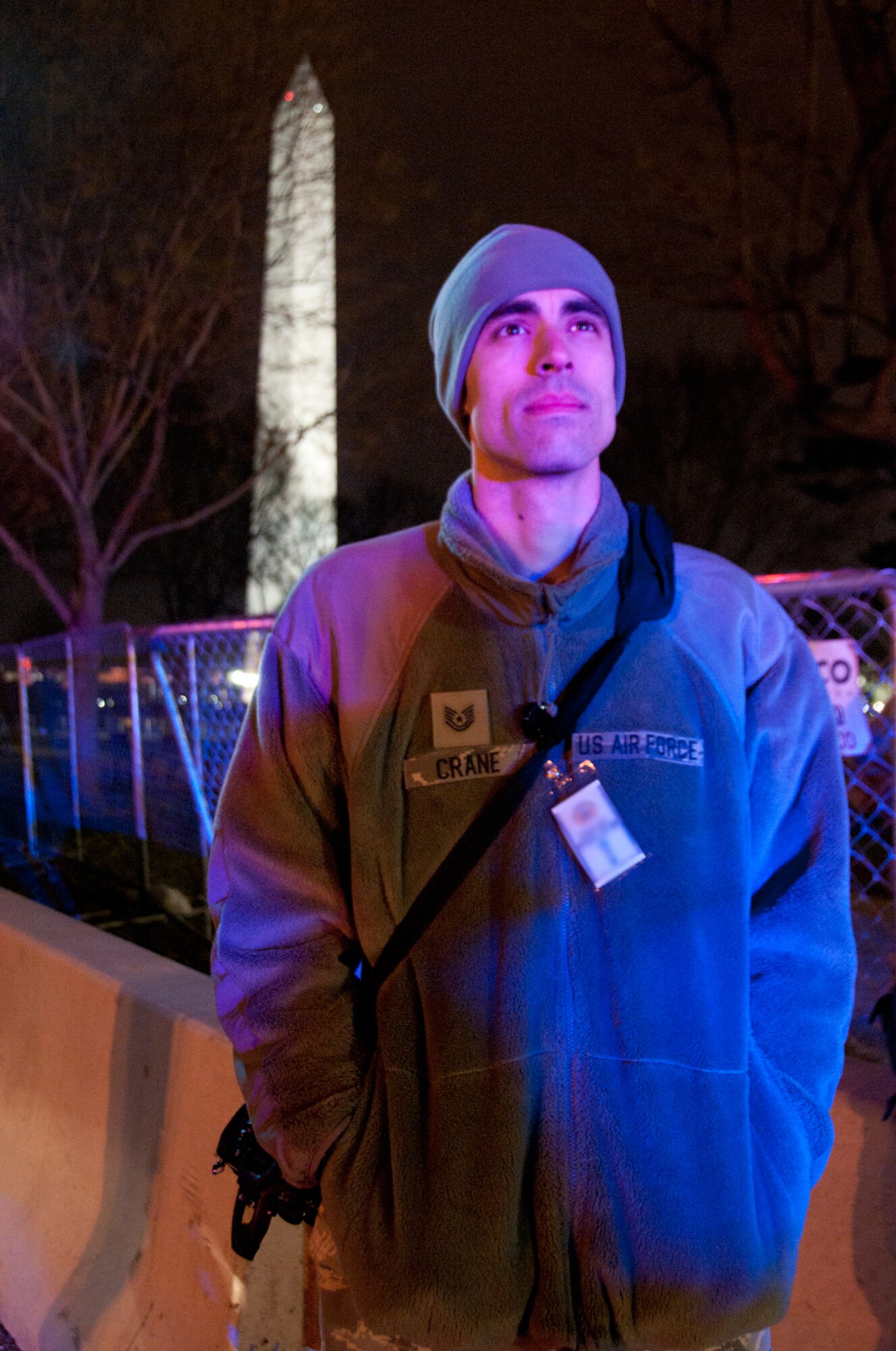 Tech. Sgt. Michael Crane, a broadcast journalist with the 139th Airlift Wing, Missouri Air National Guard, warms his hands in the predawn hours on Inauguration Day in Washington, D.C., Jan. 21, 2013. More than 6,000 National Guard Soldiers and Airmen deployed in support of the 57th Presidential Inauguration. (U.S. Air Force photo by Master Sgt. Ken Johnson)