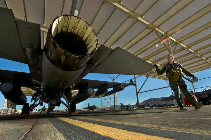 Lt. Col. Marshal Schalvares, 480th Fighter Squadron, performs preflight checks before taking part in Red Flag 13-2 Jan. 22, 2013, at Nellis Air Force Base, Nev. Schalvares walks around his jet to do a brief inspection prior to every mission to ensure mission-readiness. (U.S. Air Force Photo by Senior Airman Daniel Hughes)